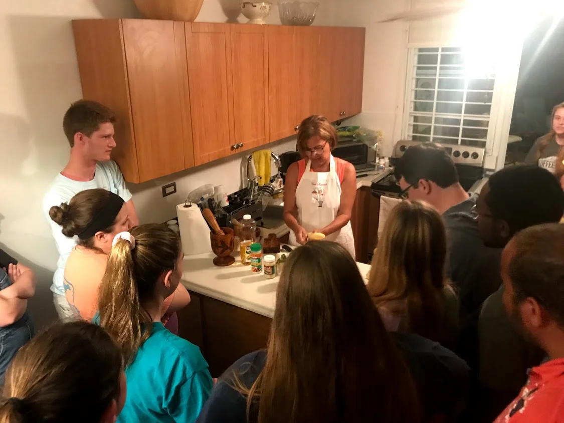 Another photo of the group learning how to make mofonog and tostones