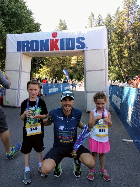 The kids with pro triathlete Andy Potts after their fun run.