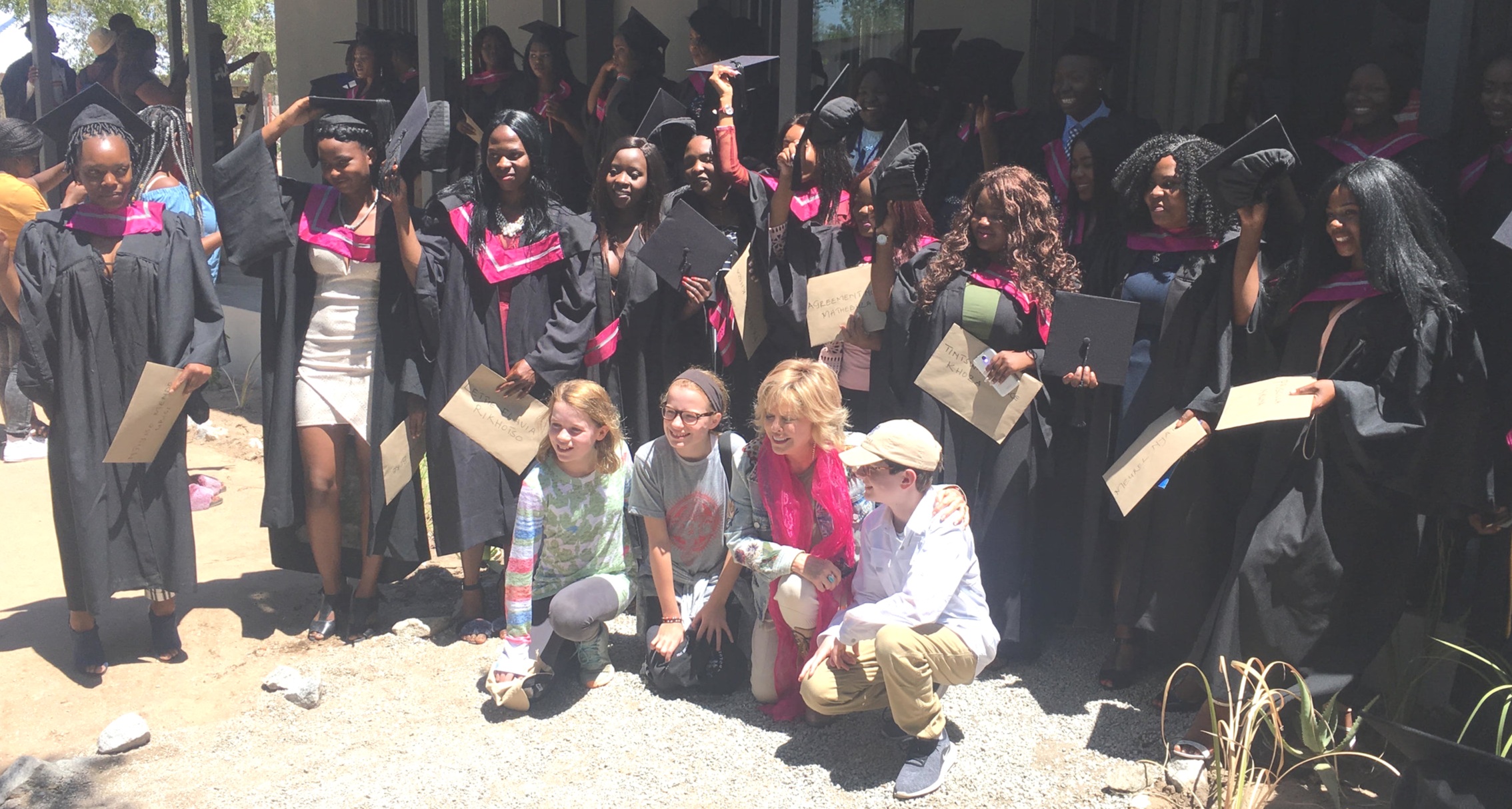  Graduates, Pat and her grandchildren celebrating after the graduation ceremony. 