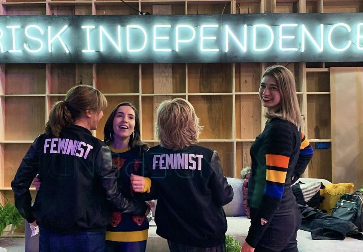 At Sundance 2019 with friends wearing our feminist varsity jackets .