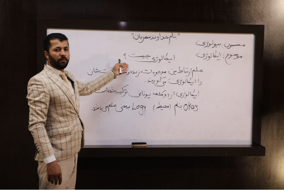  An instructor teaches a lesson on Meraj TV 