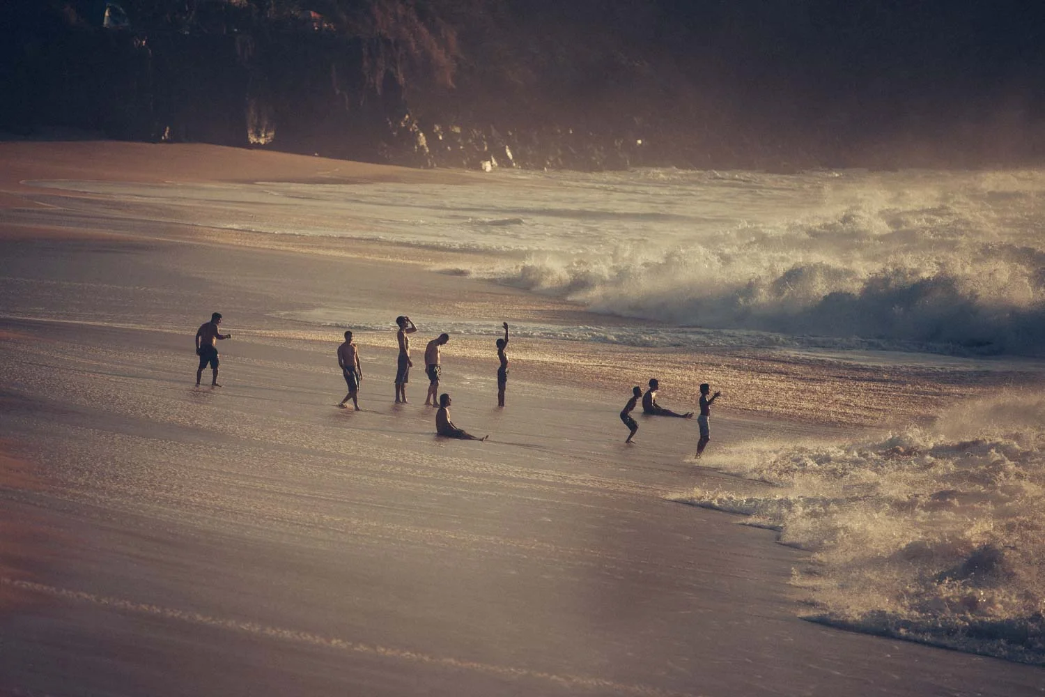 Amazing Hawaiian kids playing in the huge shore breaks.