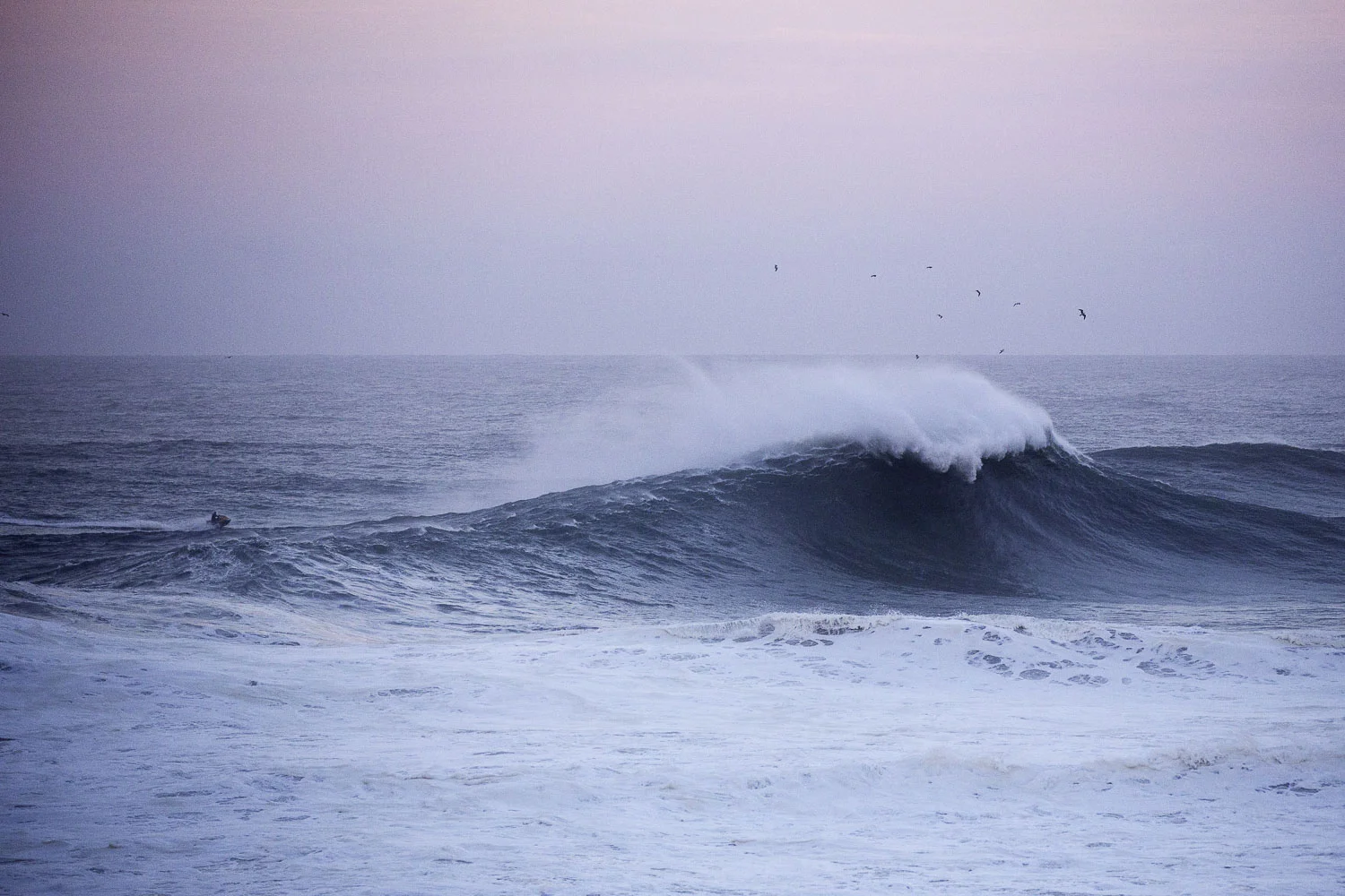 A jetski checking conditions at dawn.