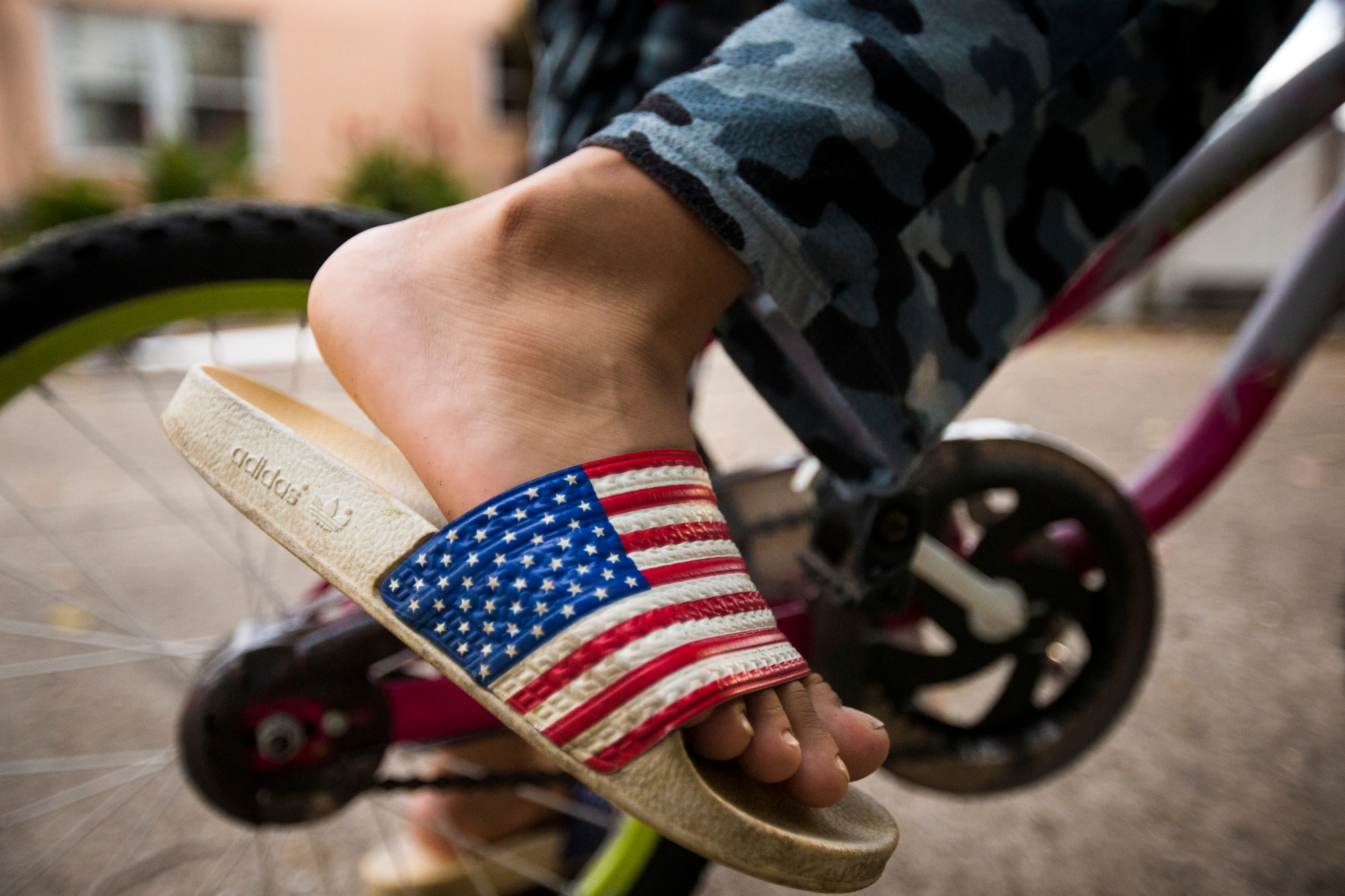  Hussein Alhamoud rides his bike around his house on Thursday, October 6, 2016. Hussein misses riding bikes and playing soccer with his friends in Syria. 