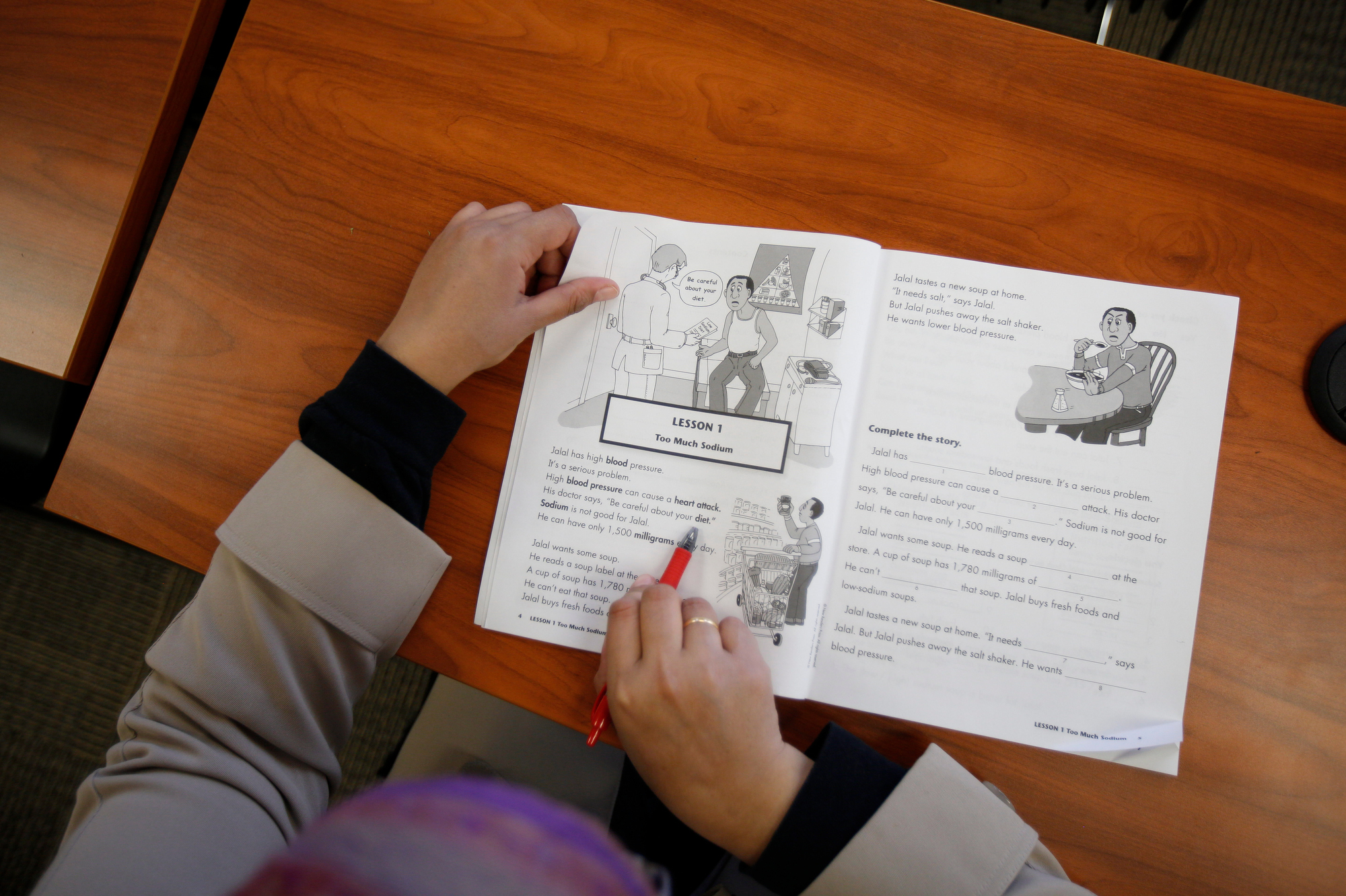  Ahlam Alhamoud practices her long and short vowels during a class at Catholic Charities of Southwest Ohio. Refugees from Bhutan, Nepal, Eritrea and Syria are learning English. 