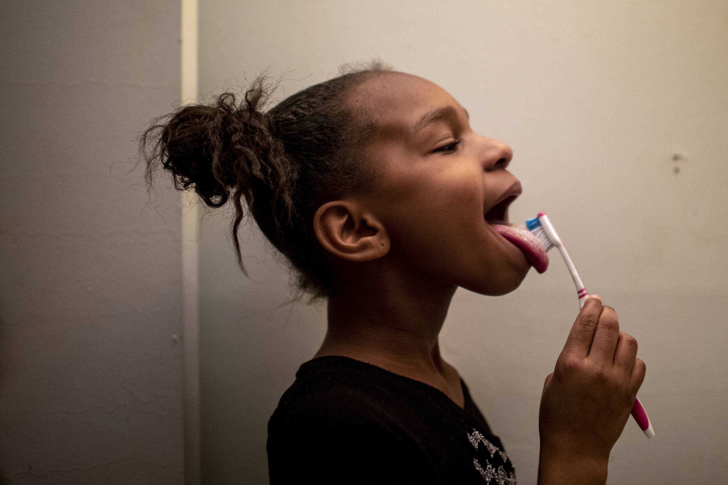  Amariyonna, 9,  brushes her teeth. 