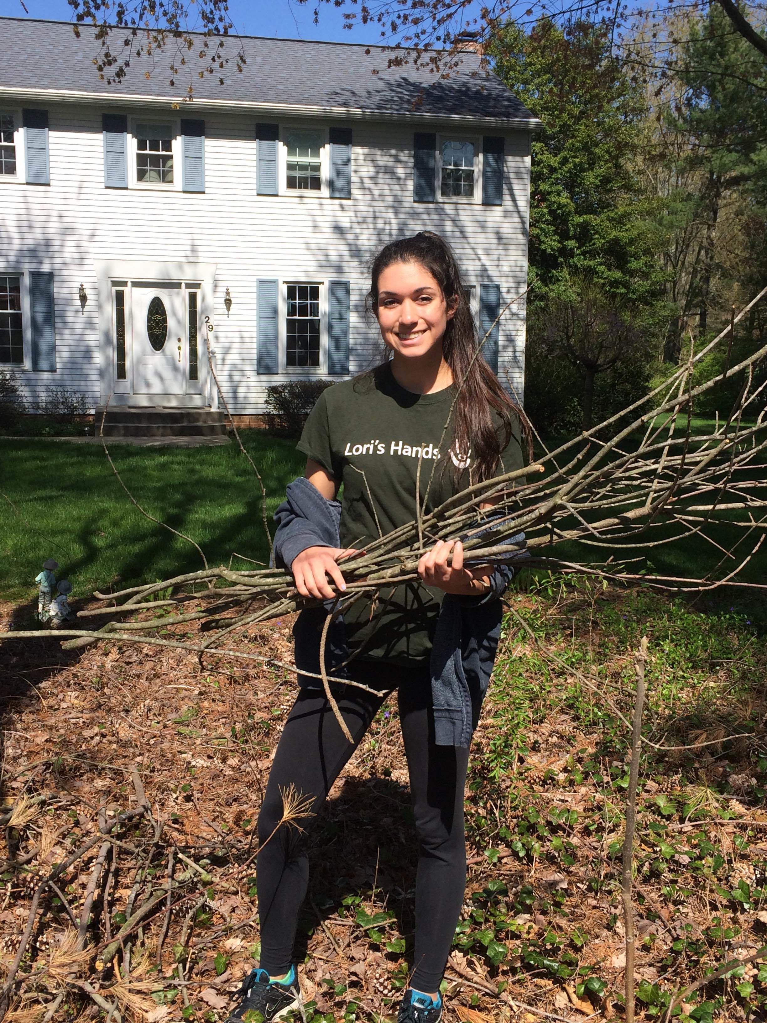 Victoria doing yard work on her visit.