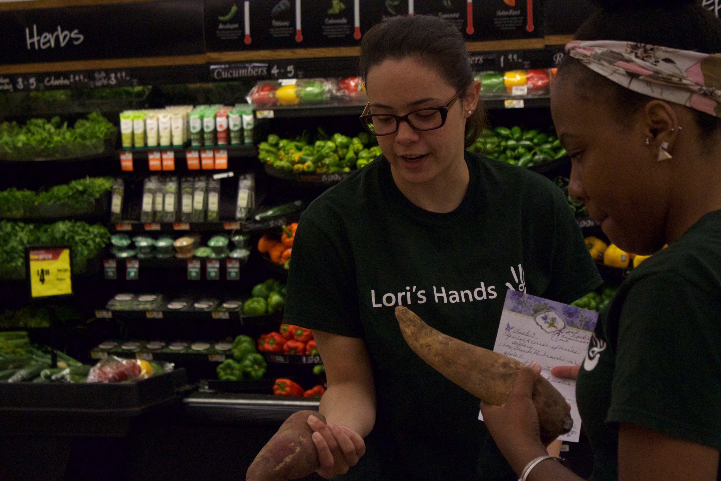 Alyssa and her student partner pick up groceries for a client