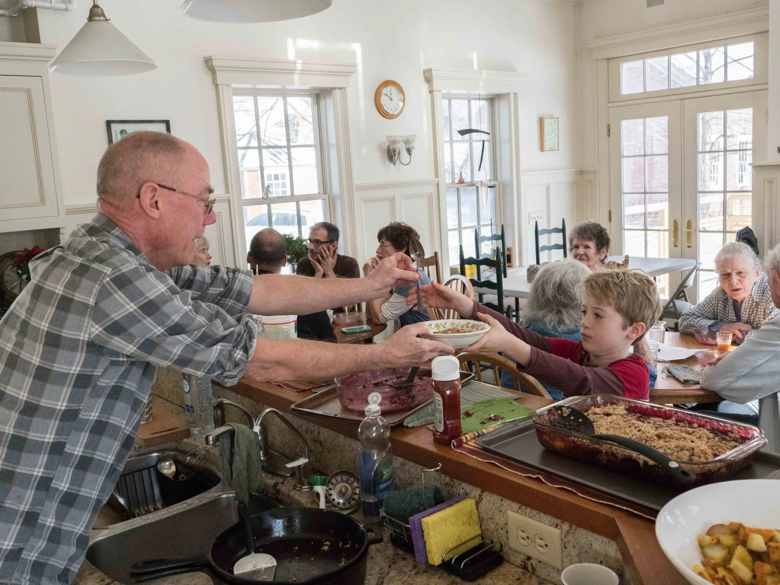 Cohousing members have the opportunity to share meals prepared in the Peake House kitchen once a week or more.