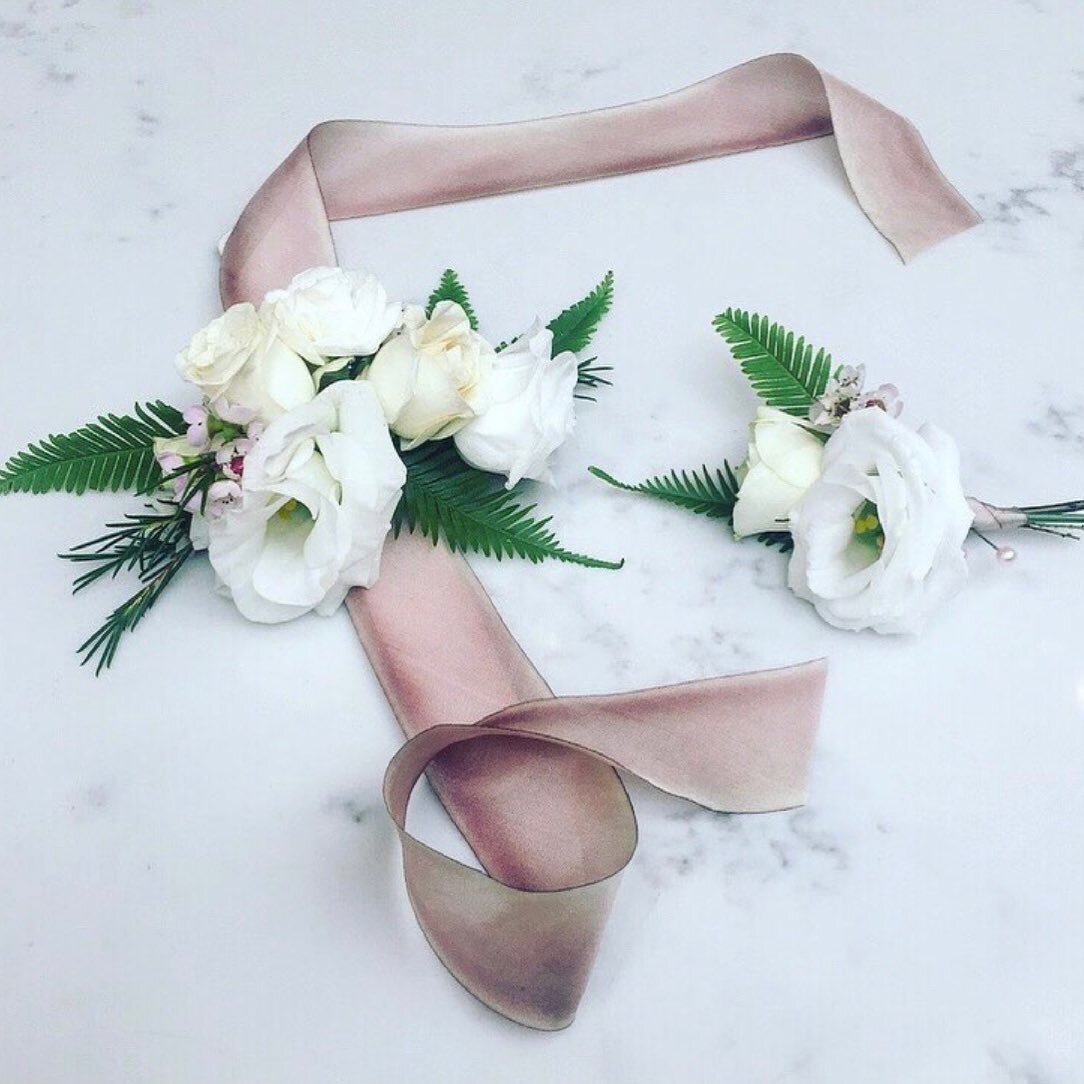 A sweet boutonni&egrave;re and corsage combo ties it all together.