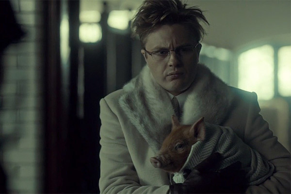 scene with one of our piglets, who is this mans pet, named pavlov.