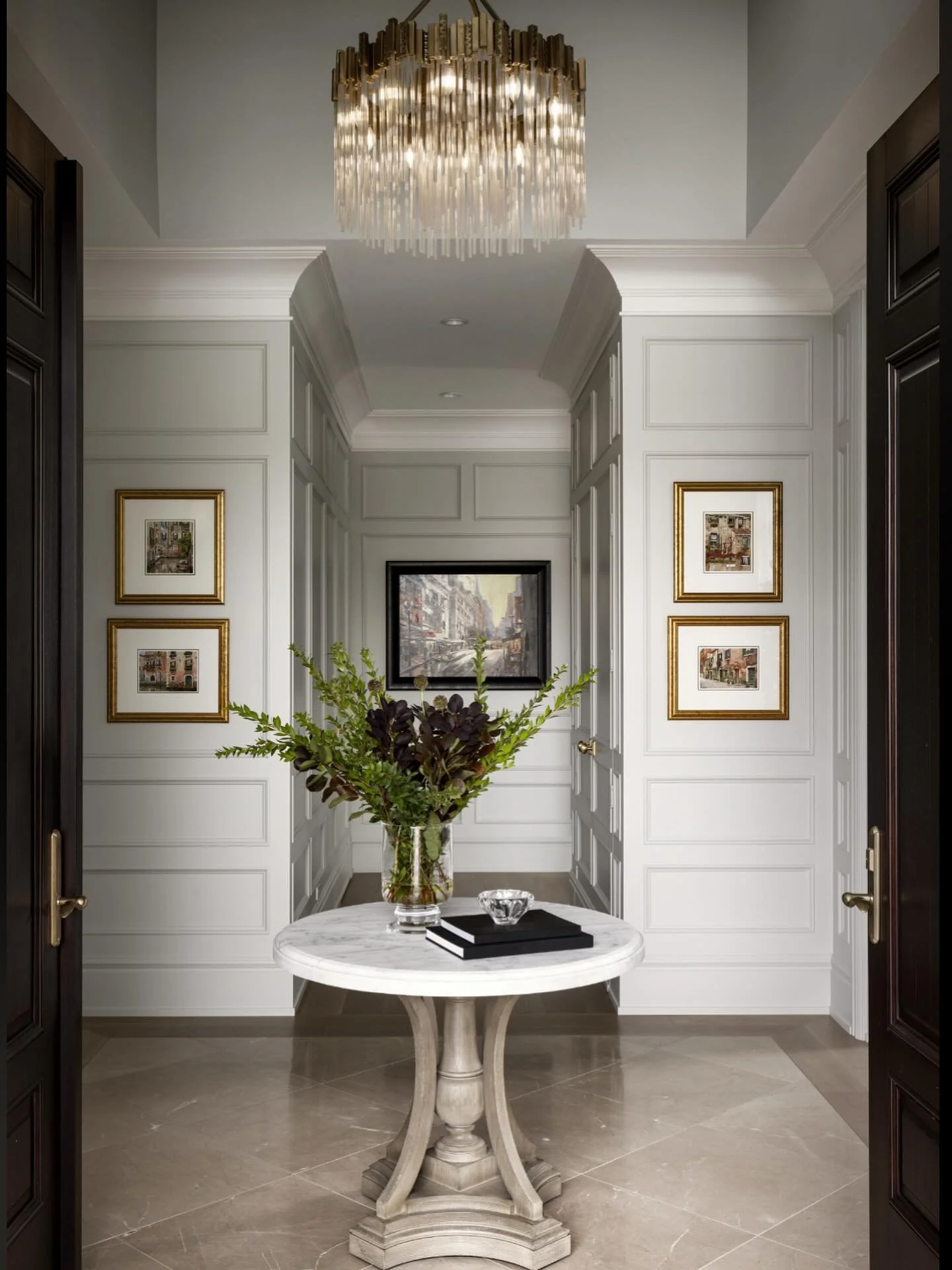 Stepping into this elegant entryway feels like the perfect blend of timeless tradition and modern comfort. Classic details, warm textures, and a welcoming glow set the tone for the rest of the home. A beautiful first impression, every time.&thinsp;&t