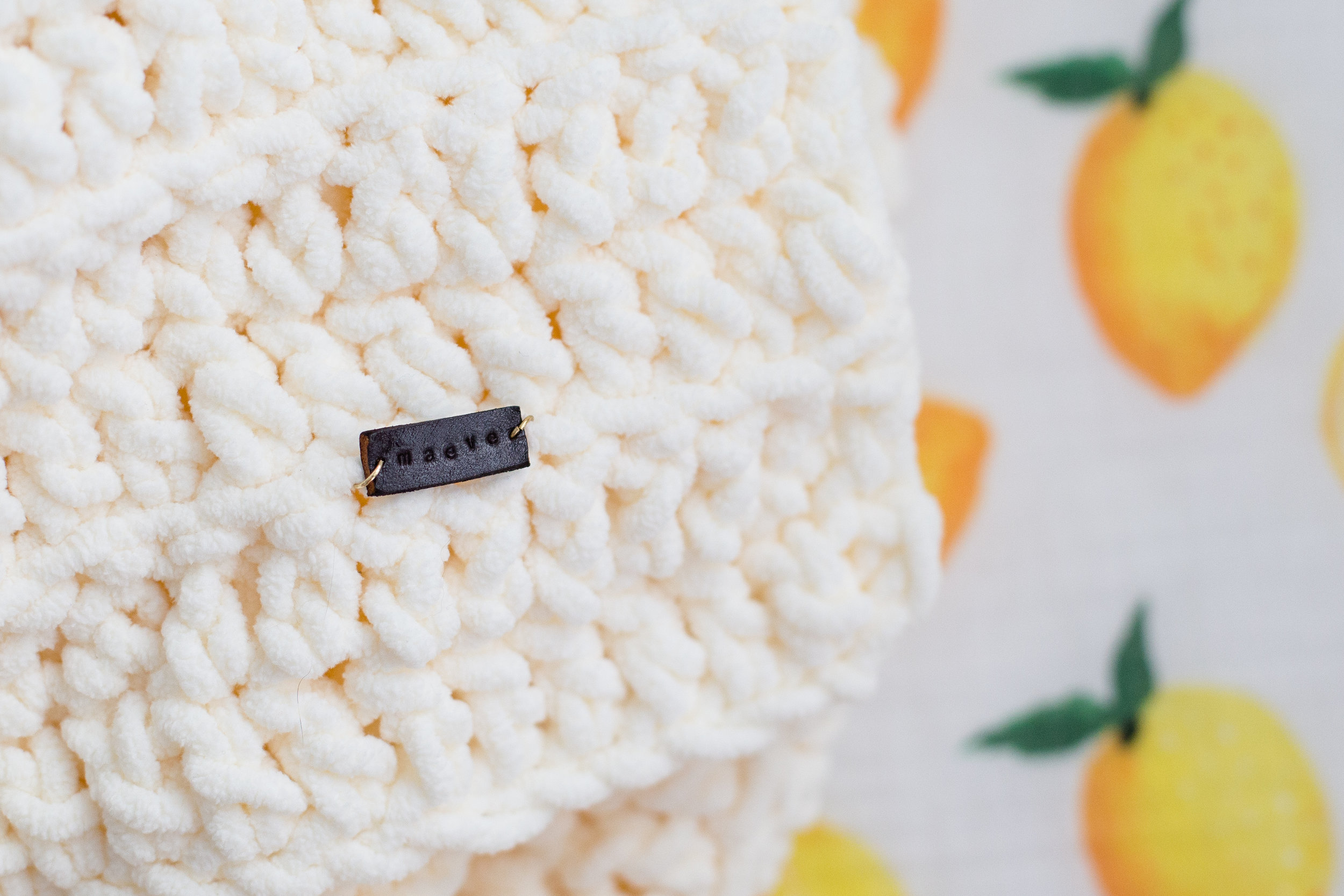 A handmade blanket with a custom, hand-stamped leather tag with her name. 