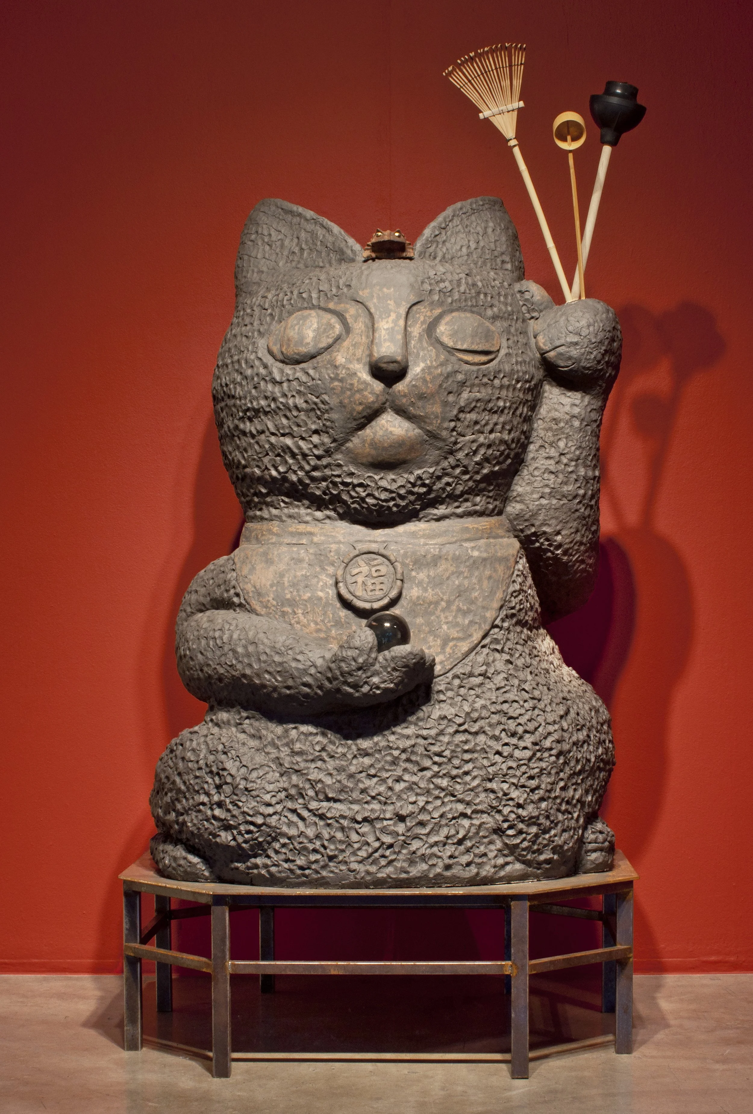 Pray for Luck , 2011 Stoneware, metal stand, mixed media 84 x 46 x 41 inches