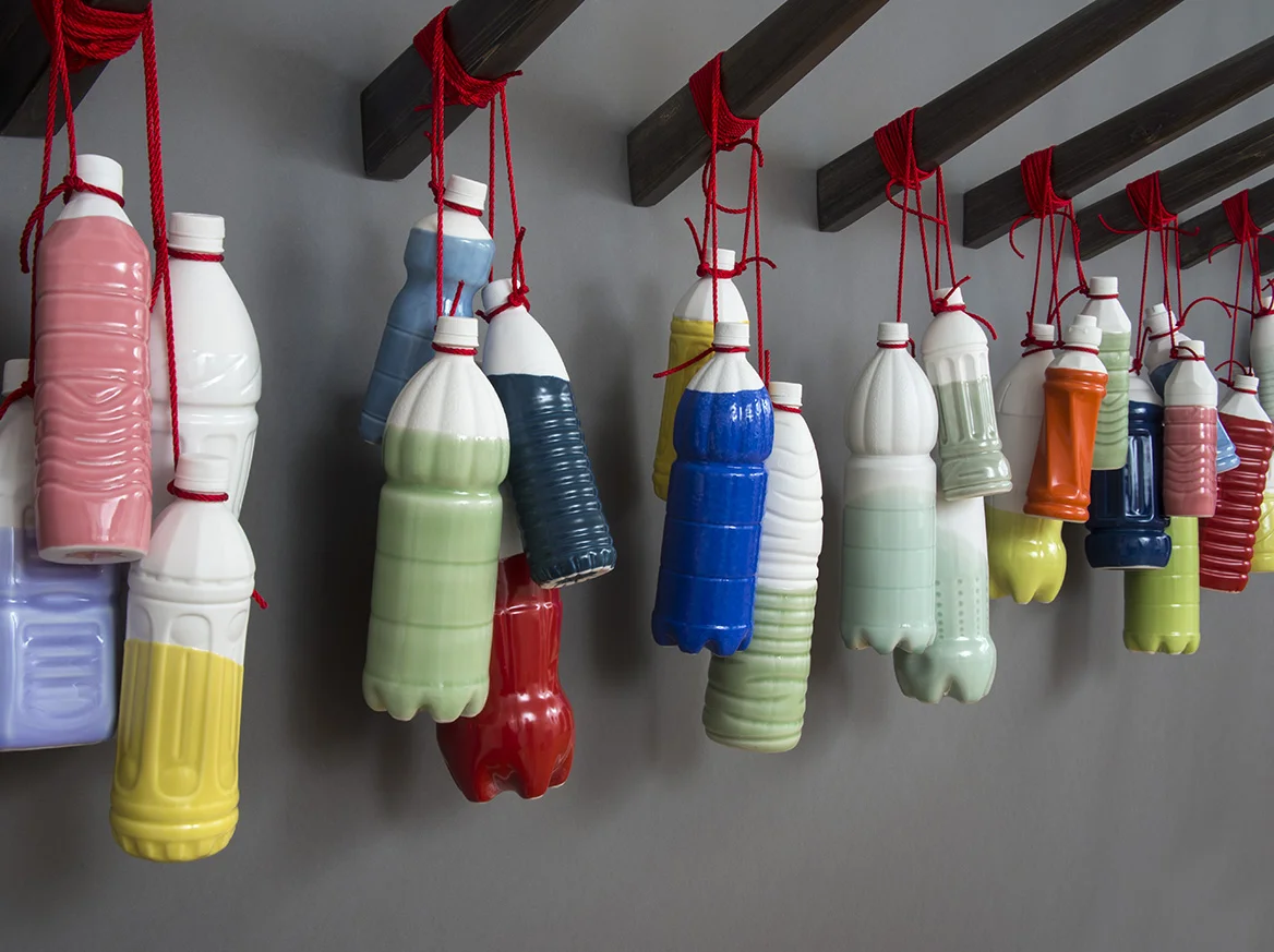   Carryman’s Handle #2 , 2015 Porcelain, glaze, red thread, wood Dimensions variable 