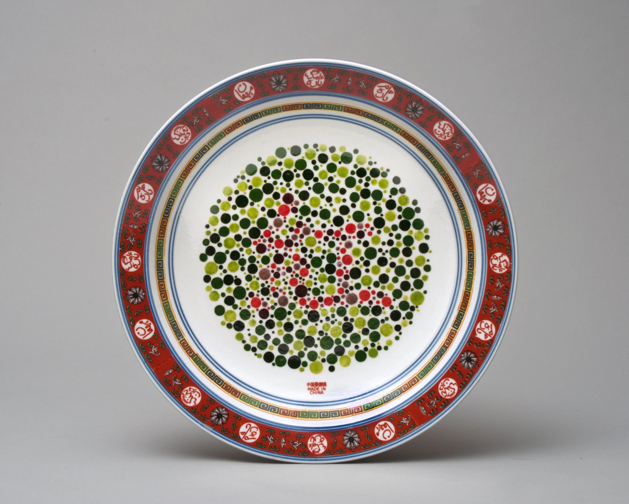   Perception Plate (紅/RED) , 2014 Porcelain, glaze, china paint, decal 17 x 17 x 2.5 inches  