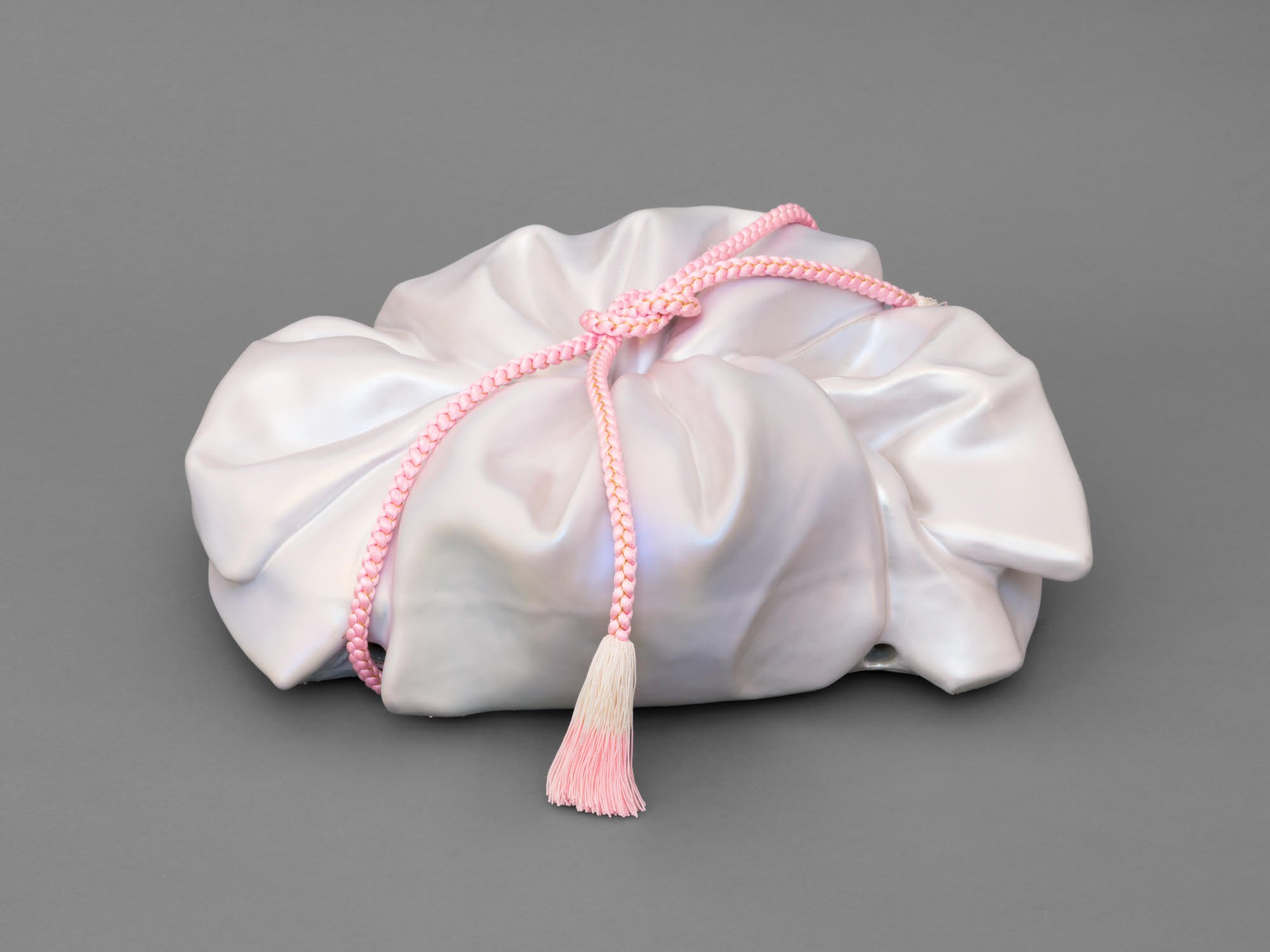   Mudai III , 2026 Porcelain, Glaze, Pearl PVD, Kumihimo&nbsp; 8 × 20 × 16 inches 
