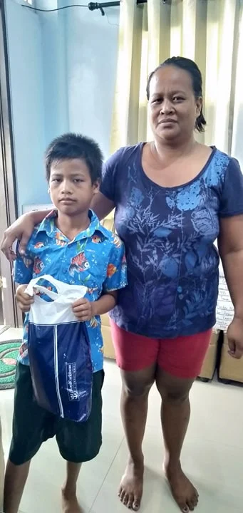 John paul Elcano of Balatas accept his gift from his sponsor.jpg