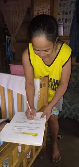 Mrs. Balilo, signing the Kasulatan.jpg