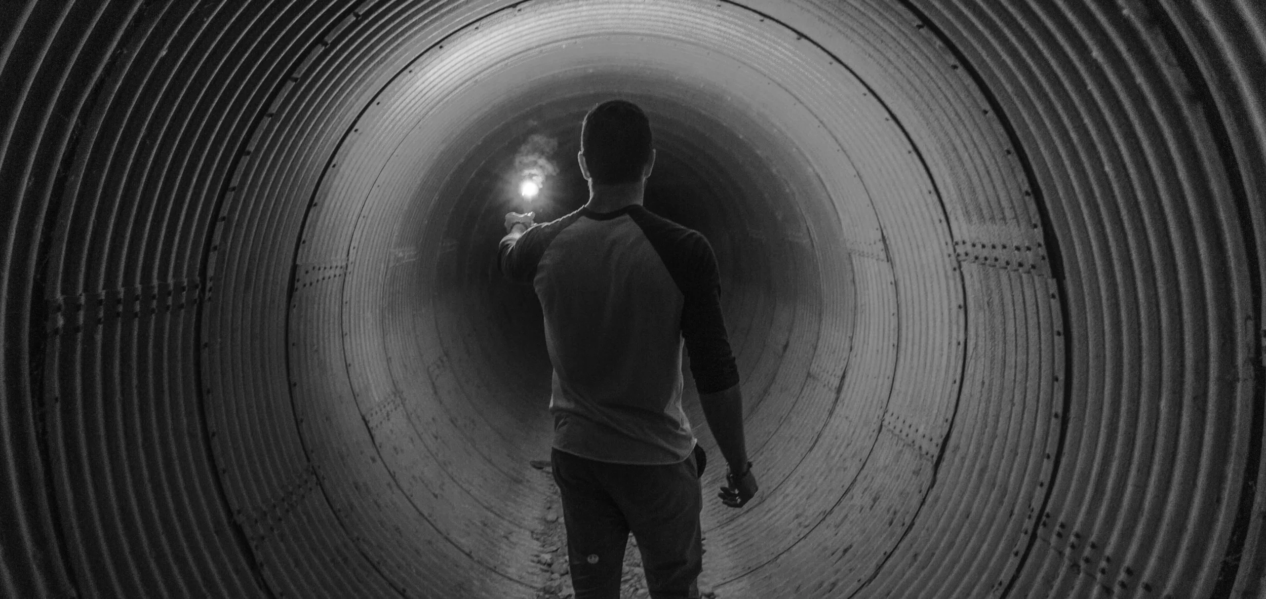 photo-1429159823131-17baa71b62a7 circle man in tunnel.jpeg