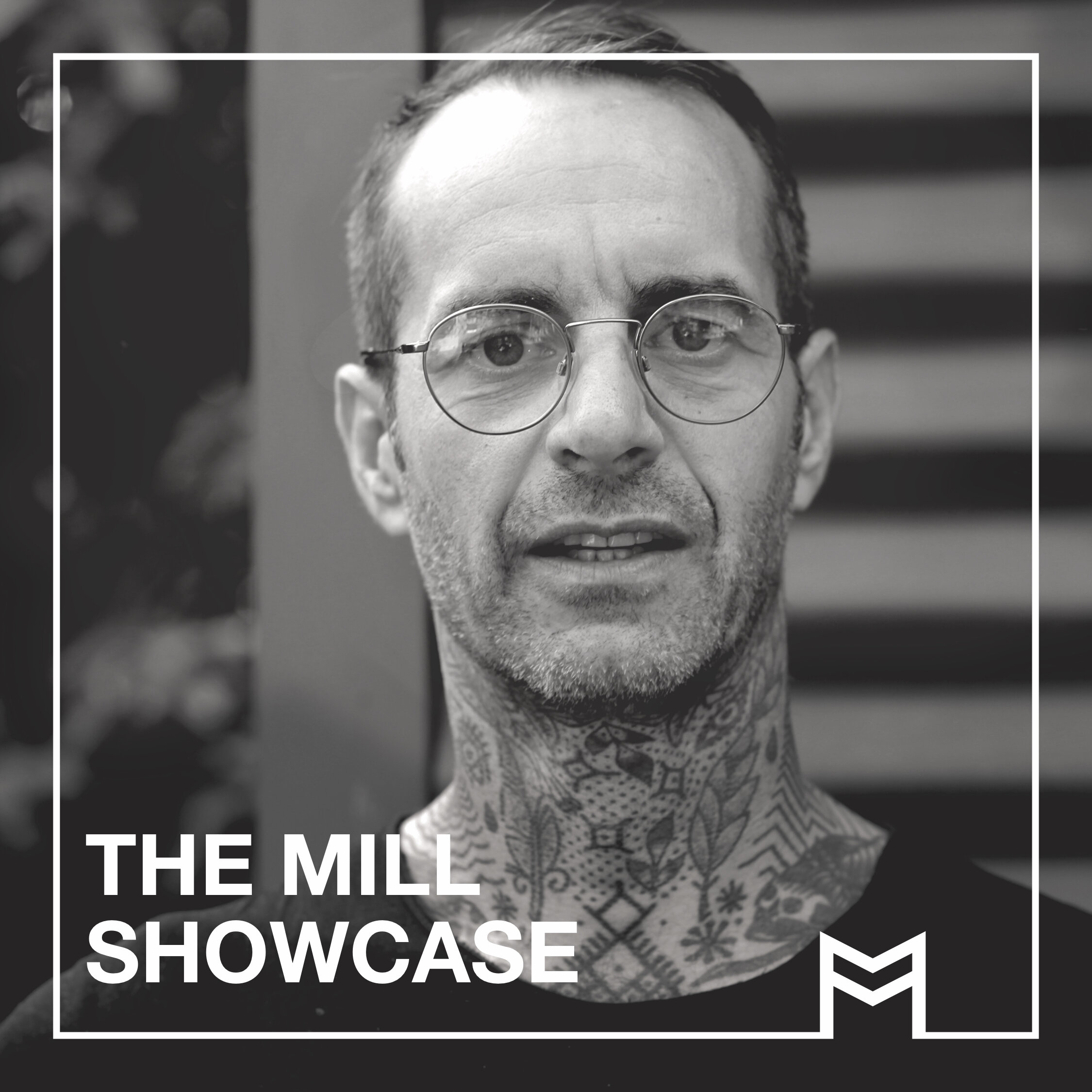 black and white image of a man with tattoos and the words 'The Mill Showcase'