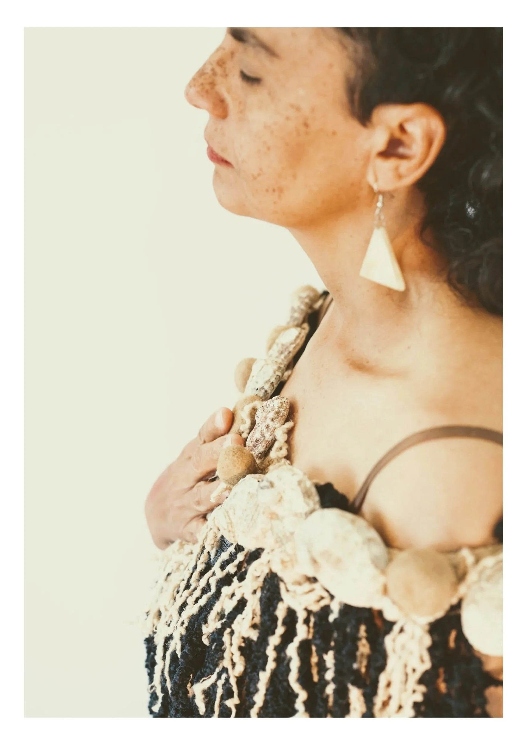 Toni Hassan. The gift of melancholy (2025). Mixed media wearable (Abalone shells, tapeweed fibre balls, wool and cotton). Photo: Ana Koch