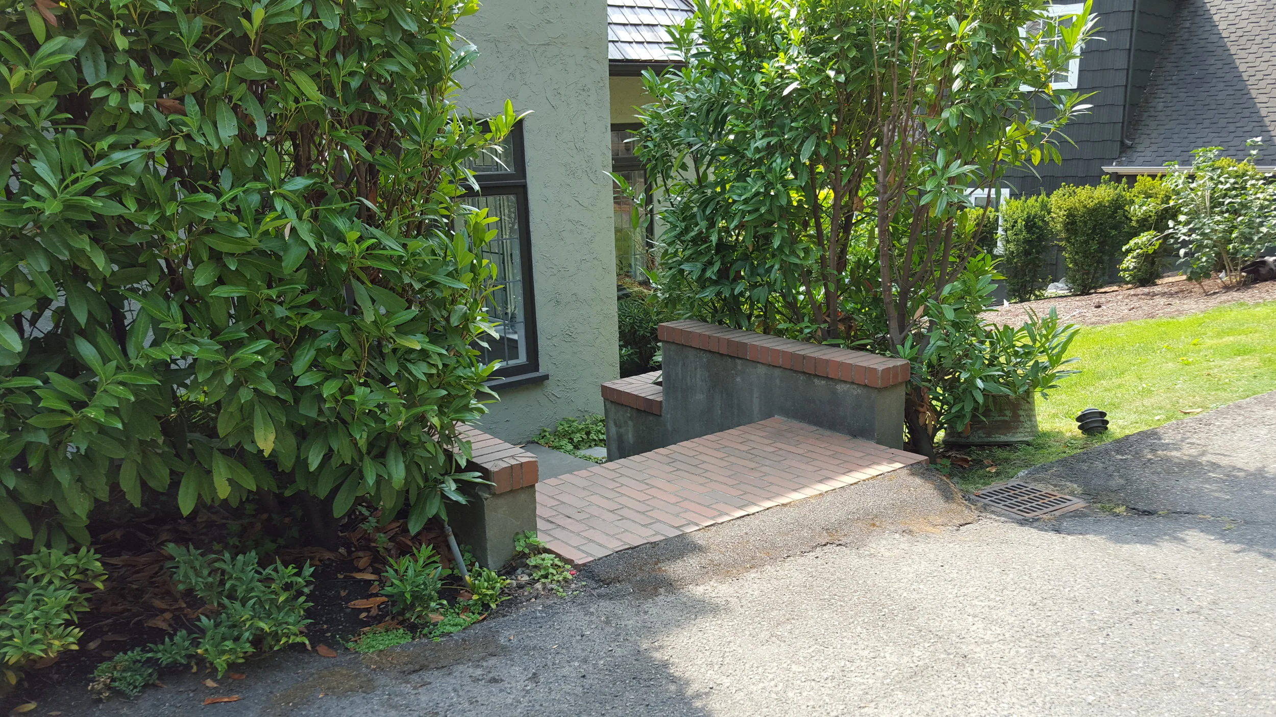Poor planning and grading at stairs results in an awkward remedy.