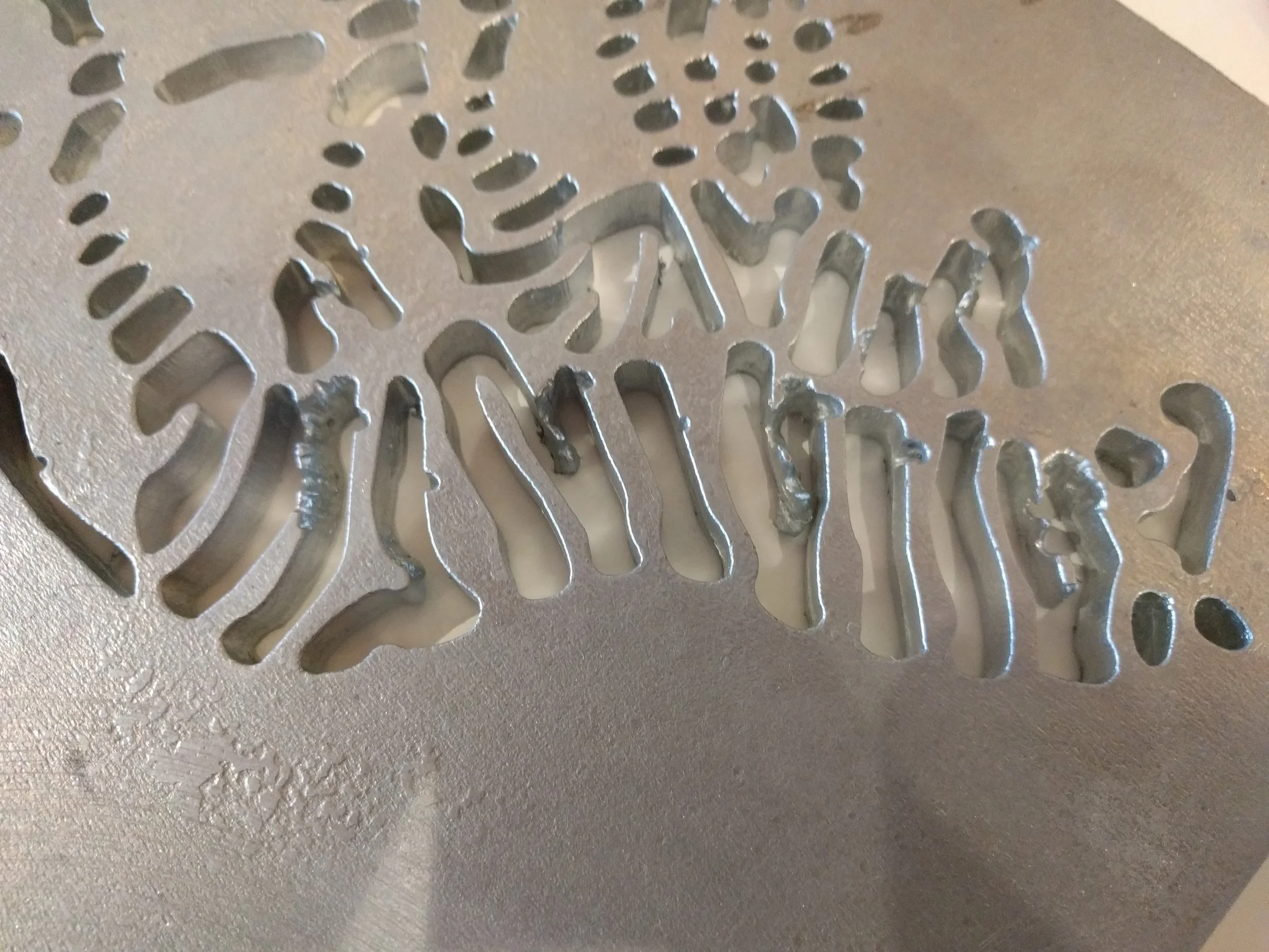 Sample piece showing pitting where the cuts are too close and on “peninsulas”