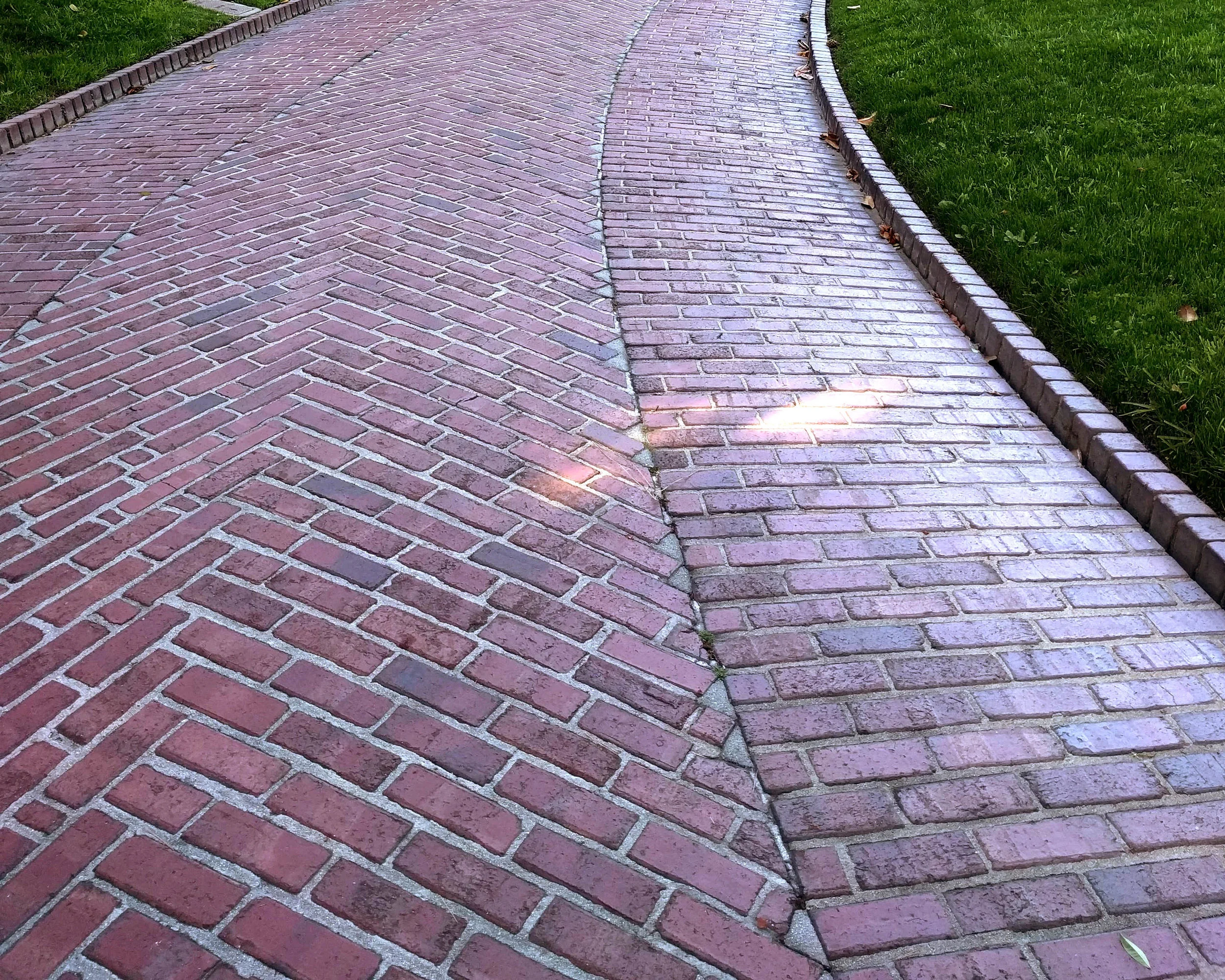 Multiple patterns and an integrated curb feature in this historic driveway at the Gamble House in California.