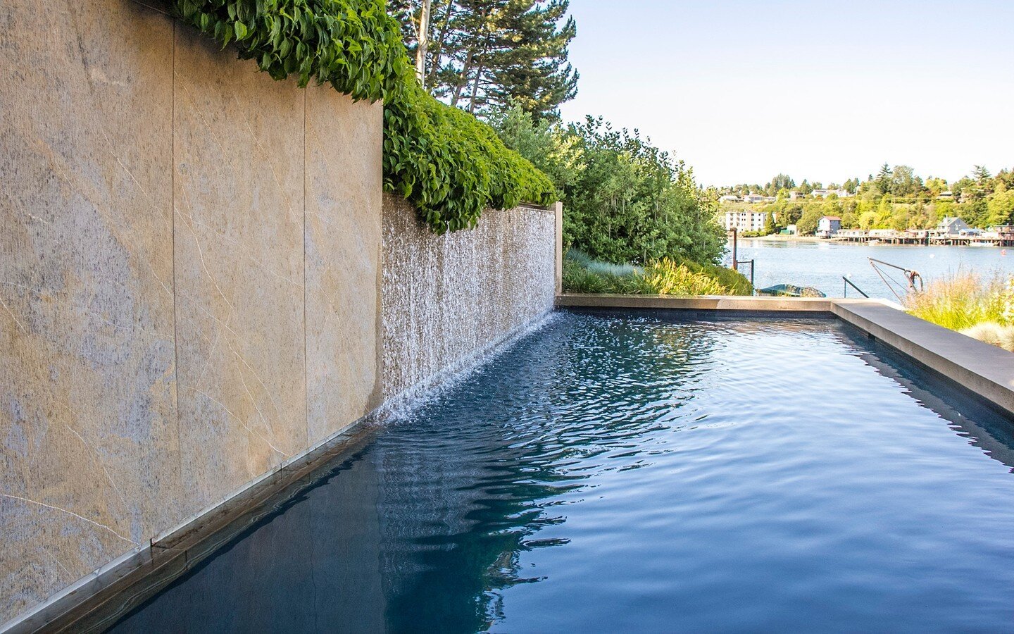 One of our all-time favorites: We love the clean lines on this Seattle swimming pool, which doubles as a beautiful water feature.  By @landmorphology

#waterfeature #seattlegarden #swimmingpool #waterfrontrealestate #activegarden #landscape #seattled