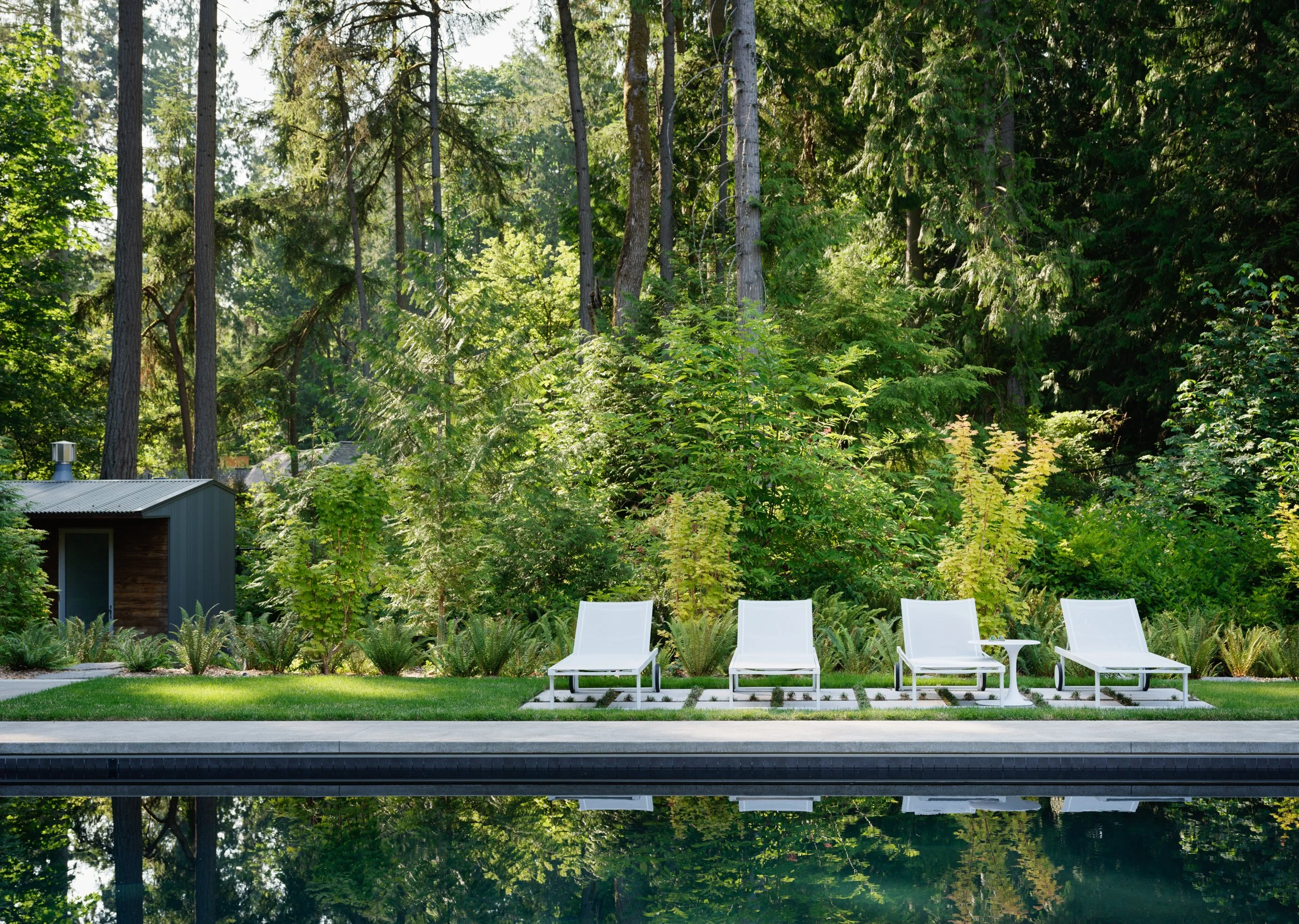 Swimming pool and lounge chairs at Interurban Residence
