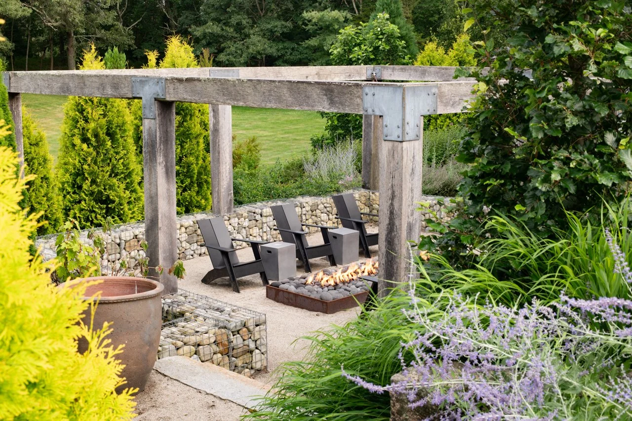 Fire feature with arbor and gabion walls