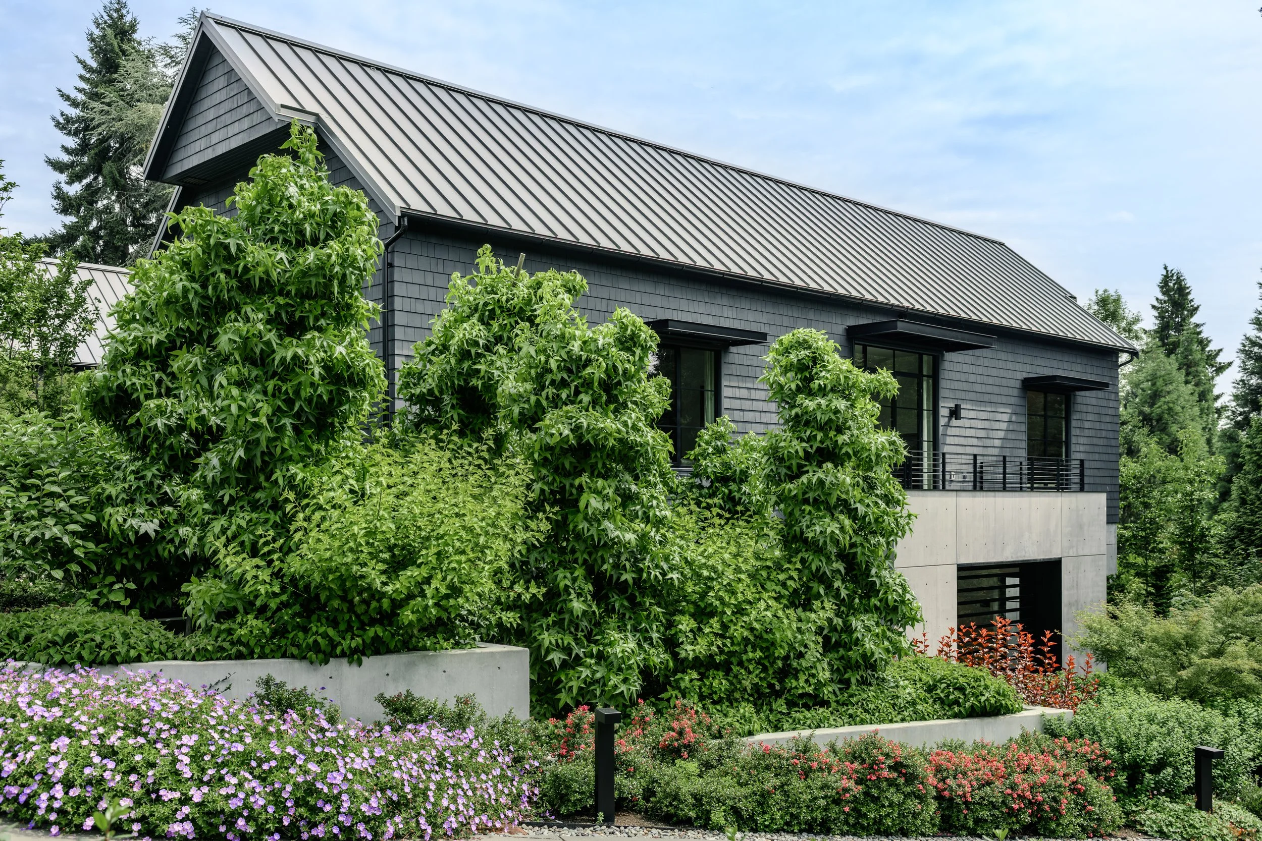 Side view of Garage Pavilion with landscaping of bioretention cells by Land Morphology.