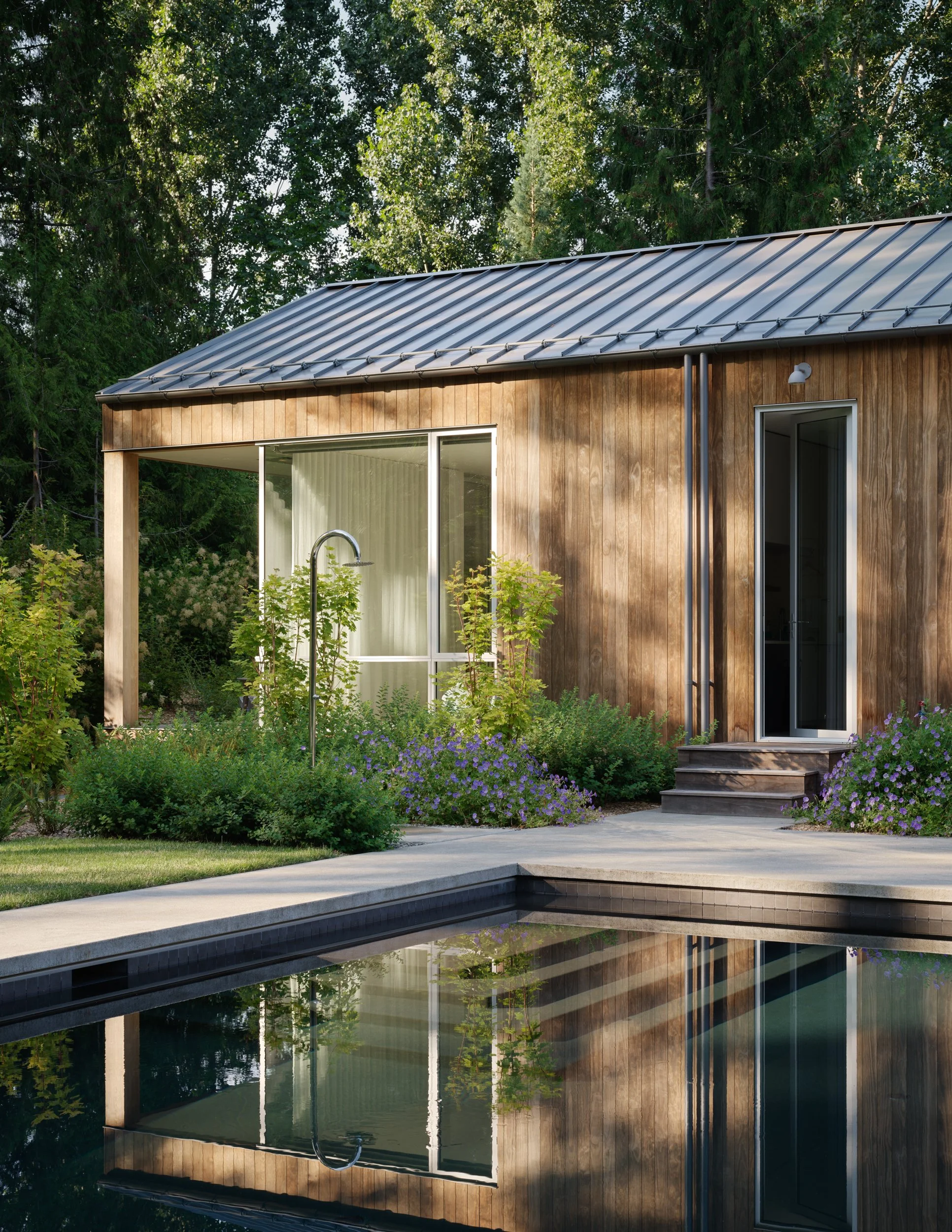 Outdoor shower and swimming pool at Interurban Residence