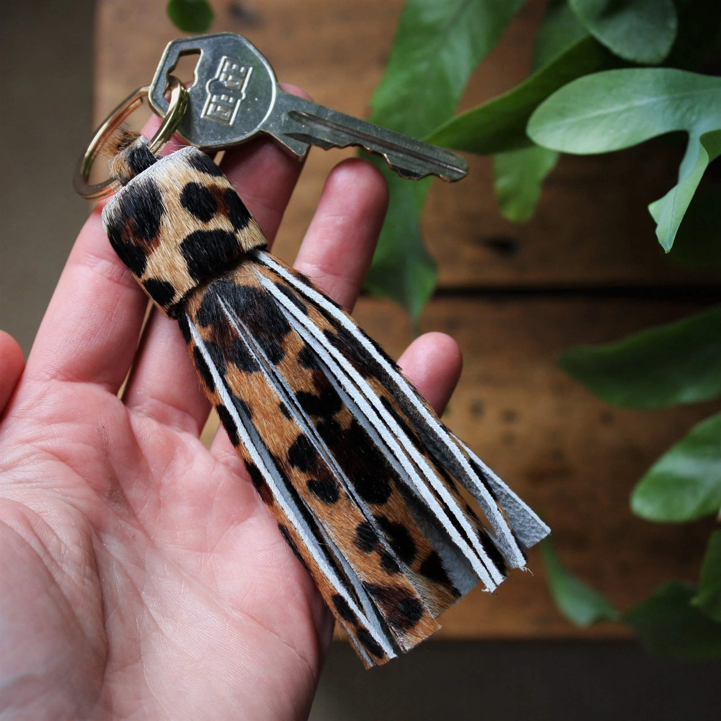 leopard print tassel in hand.jpg