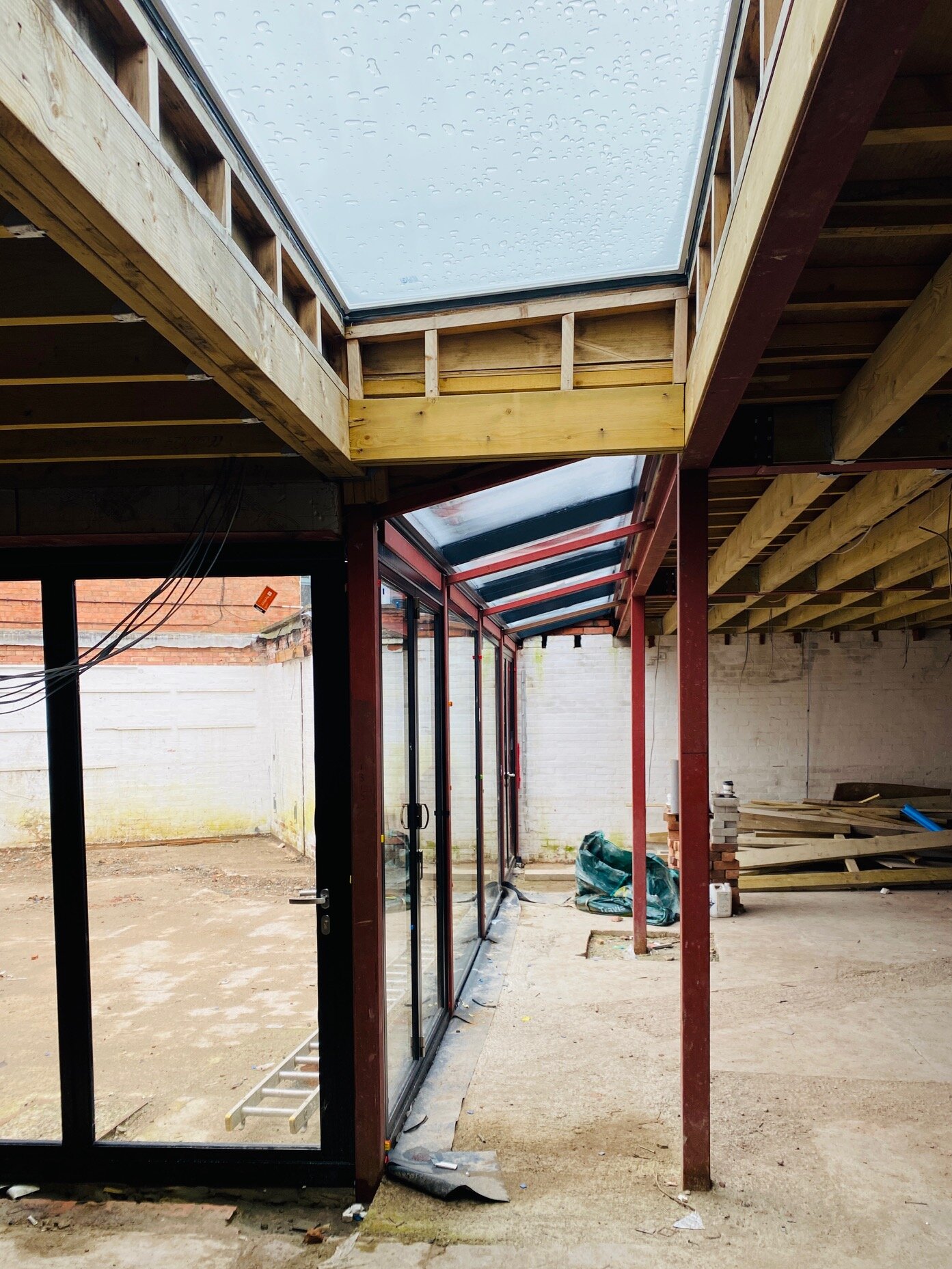  Under construction : The steel frame, the roof and the enormous glass rooflights are on!  The space is really coming together.  