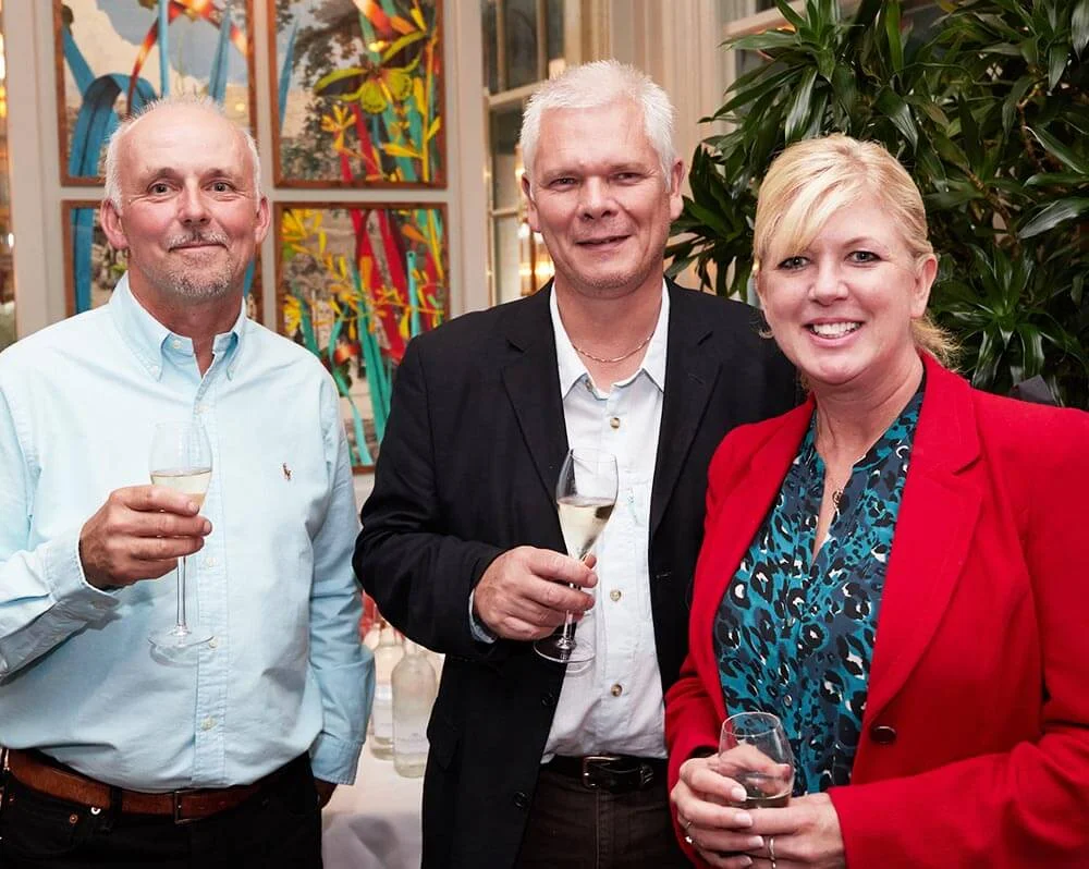 Mark Templeman of Norwich Rotary with Matt and Steph Brown of Wild Knight Distillery