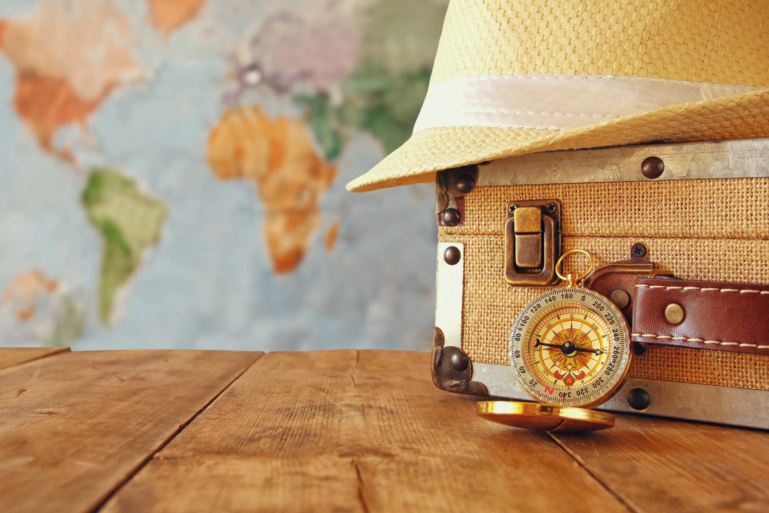 traveler vintage luggage, compass and fedora hat