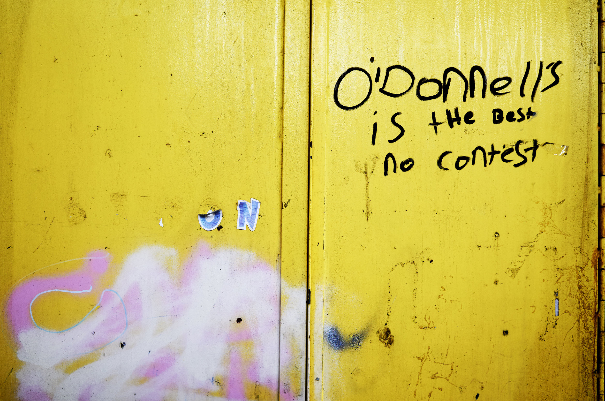 Graffiti scrawled across the back doors to the site’s school building.