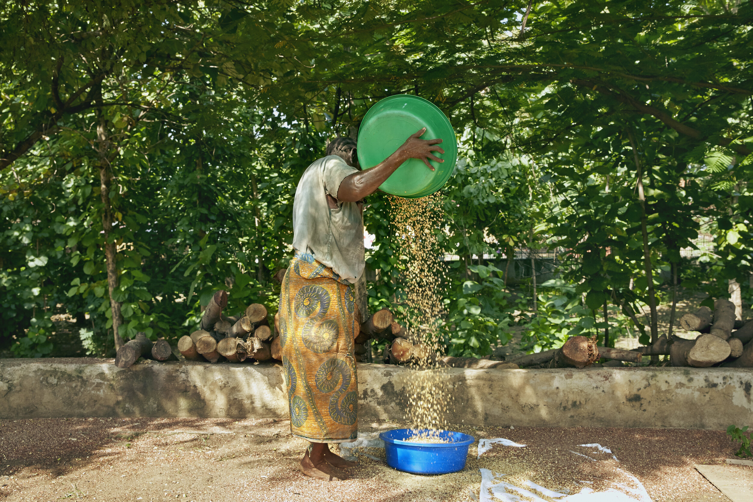 A woman winnows ground nuts in Juba, South Sudan