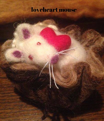 mouse in brown pouch.jpg