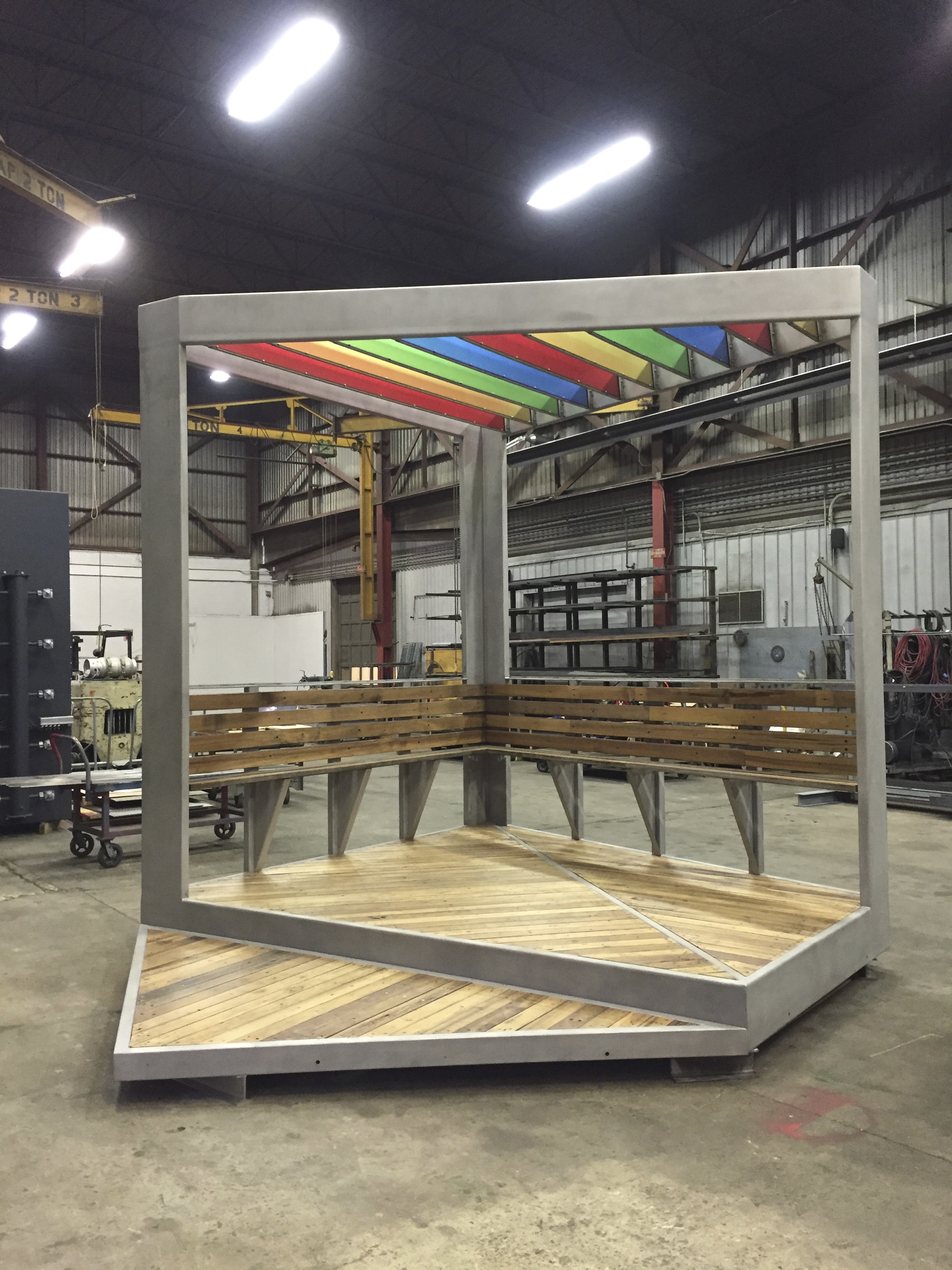 Austin Thomas Plaza Perch, 2016 Stainless Steel, wood decking, acrylic panels 15’ x 11’ x 12’ Soon to be completed stainless steel gazebo-like structure, commissioned by New York City's Department of Cultural Affairs Percent for Art Program. Plaza Perch will feature a colorful acrylic trellised roof and bench for the newly built Humboldt Plaza in East Williamsburg, Brooklyn, NY along Moore Street directly in front of the Moore Street Market. Plaza Perch will be the focal point of the plaza.