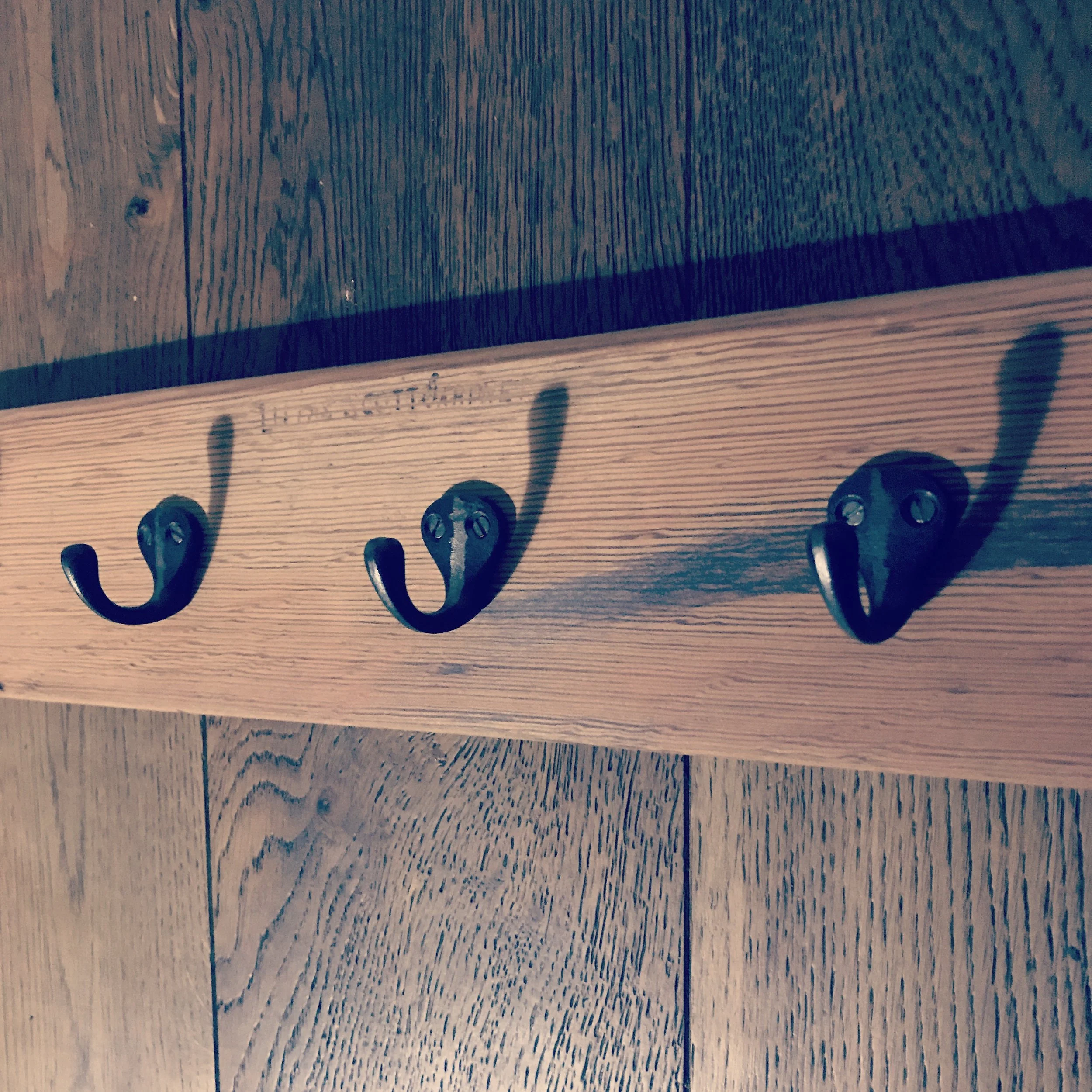 Coat hooks made from recycled pews