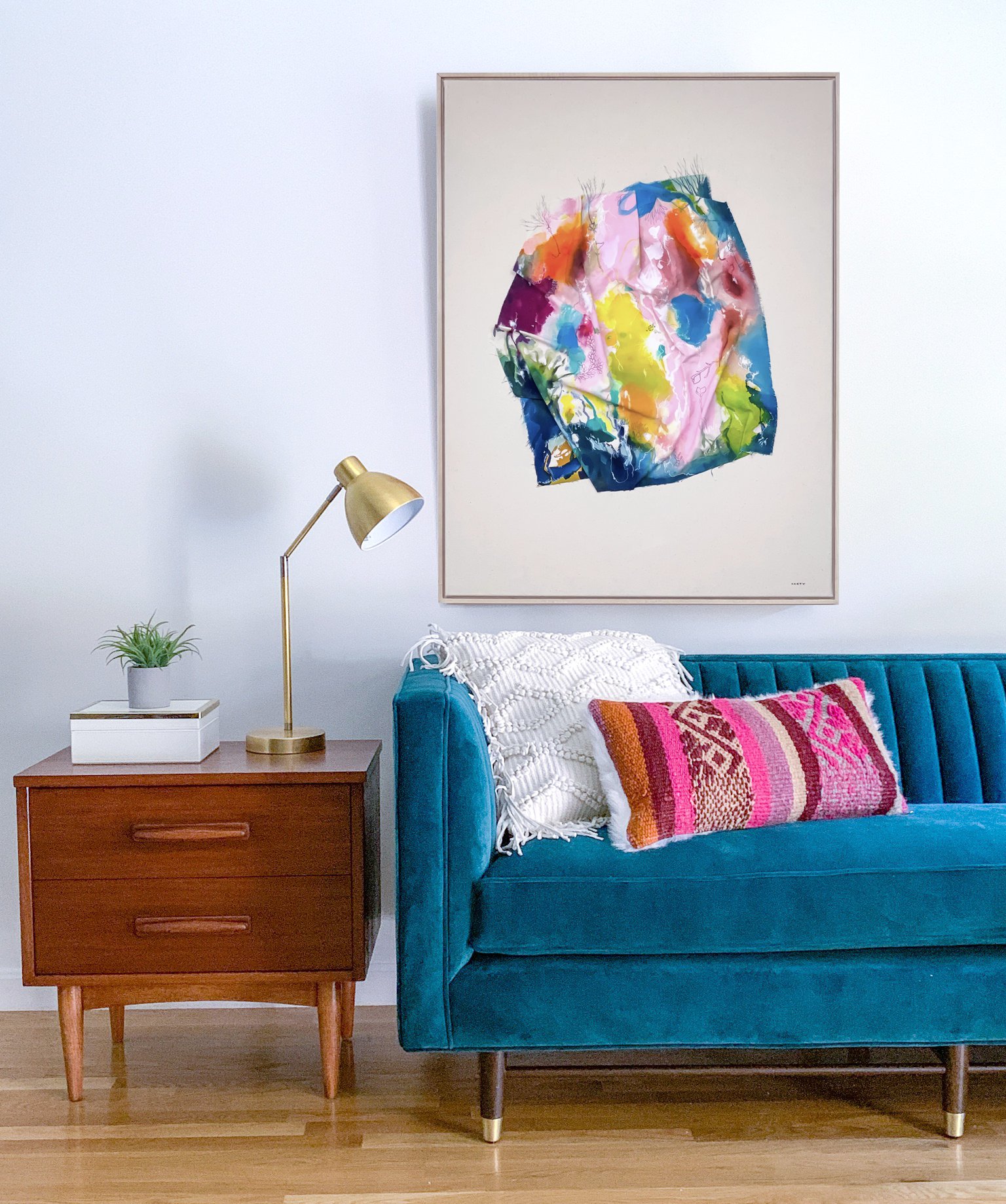 New England sculptural abstract landscape painting by artist Megan Carty with a joybird teal couch