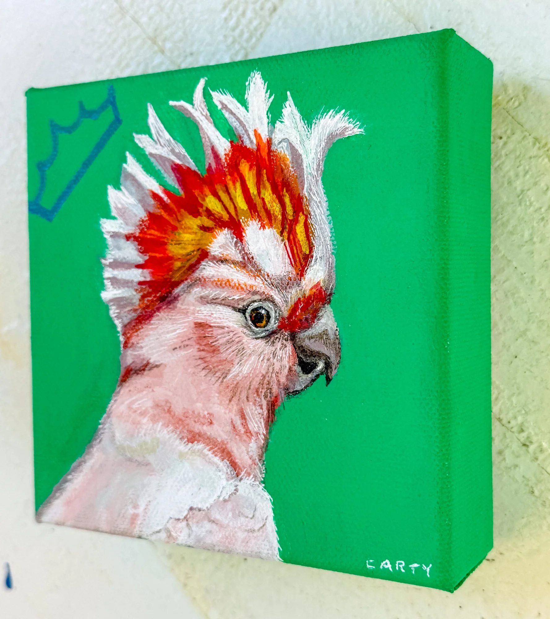 5x5 inch painting of a Major Mitchell Cockatoo wearing a crown by Megan Carty