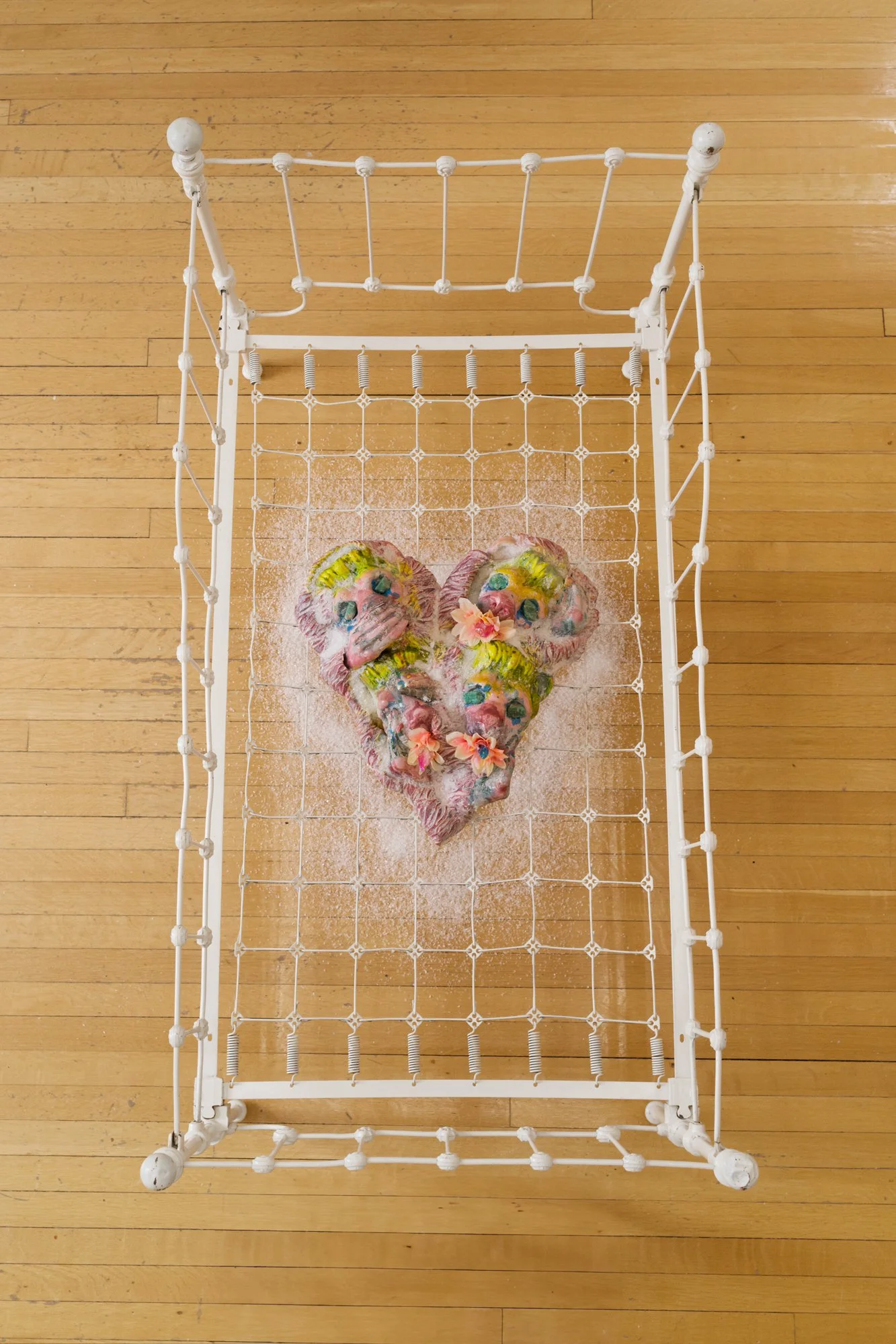 Kris Lemsalu_Crimson and Clover_2024_Sculpture, ceramic, found bed, dimensions variable_Top view.jpg