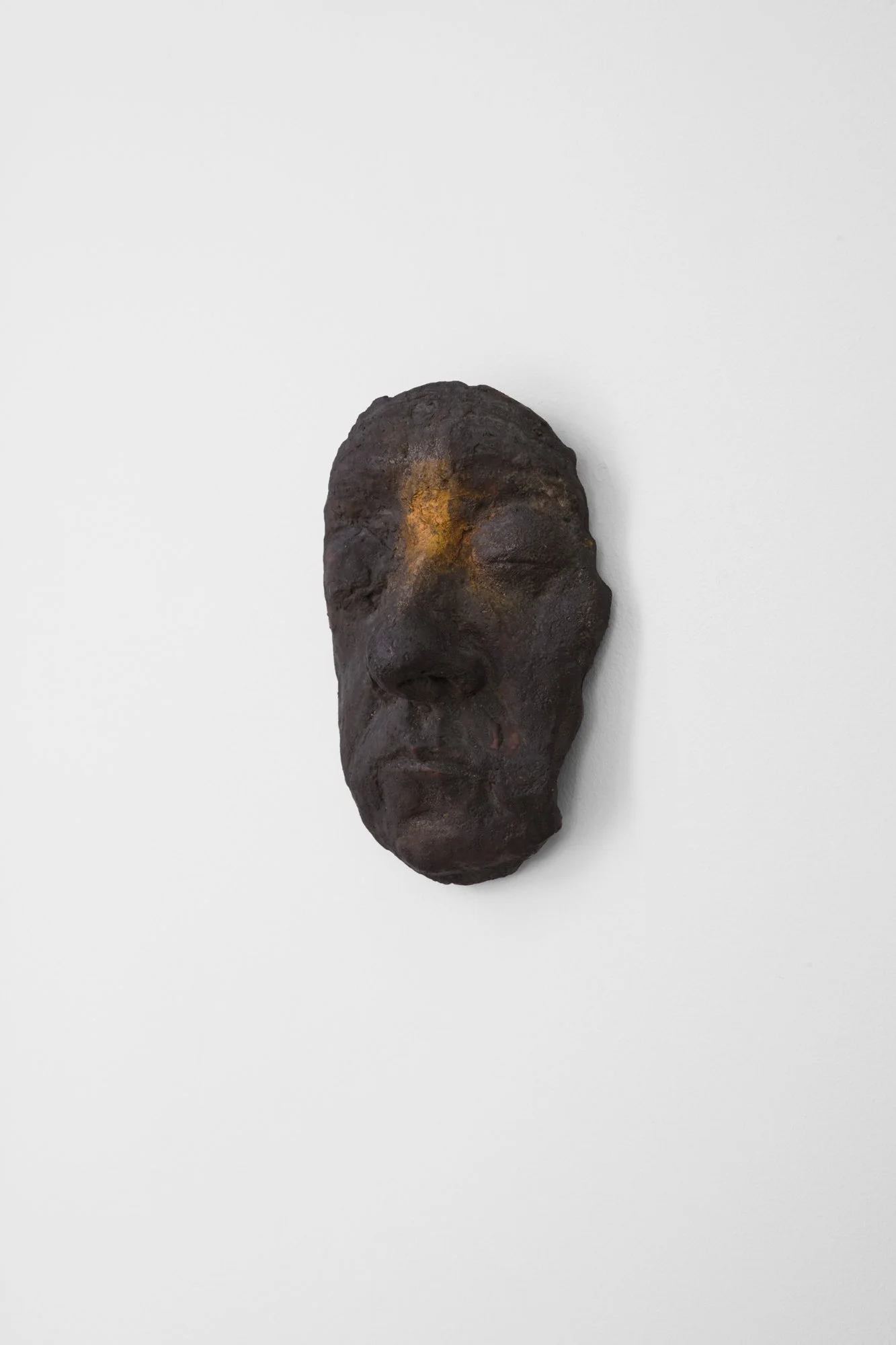 Marion Wagschal_Mask of My Mother_Ceramic and gold paint_8. x 5.5 x 1.5 inches_side.jpg