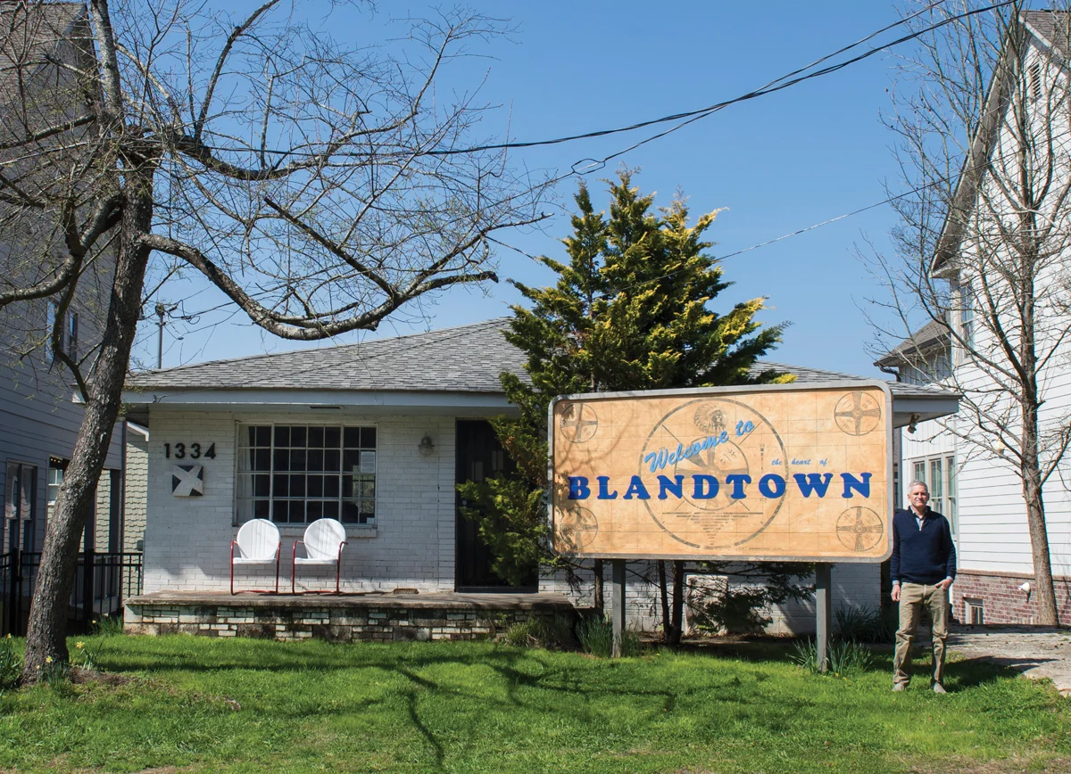 Turk’s sign, tinged with dirt the artist took from a nearby excavation, echoes a TV test pattern used in the 1940s to signal a station was between broadcasts—much like how Blandtown is between stages in its evolution. PHOTOGRAPH BY CAROLINE C. KILGORE