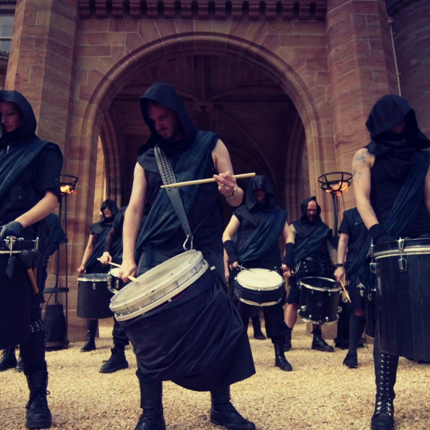 Holy hell this is a cool shot! Super stoked to put 'Alan Cummings' mysterious hooded drummers' on our list of odd gigs

If you haven't seen it yet, US Traitors Season 2, featuring your favourite Industrial Drumcore crew, is streaming in the US on Pea