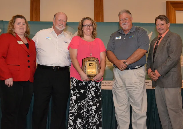 Stockbridge Valley FFA Advisor Erin McCaffrey (center) was presented with the Teacher Mentor Award. If you ask agriculture teachers what motivated them to enter and stay in the teaching profession, predominately they will attribute their decision to another agriculture teacher who encouraged them. Many state agricultural education associations have recognized the importance of positive relationships between beginning and experienced teachers by creating formal organizational structures to connect beginning and experienced teachers. This award program will provide additional incentives for experienced teachers to become mentors for beginning teachers, and it will provide beginning teachers a way to say thank you to the experienced teachers who have influenced them.